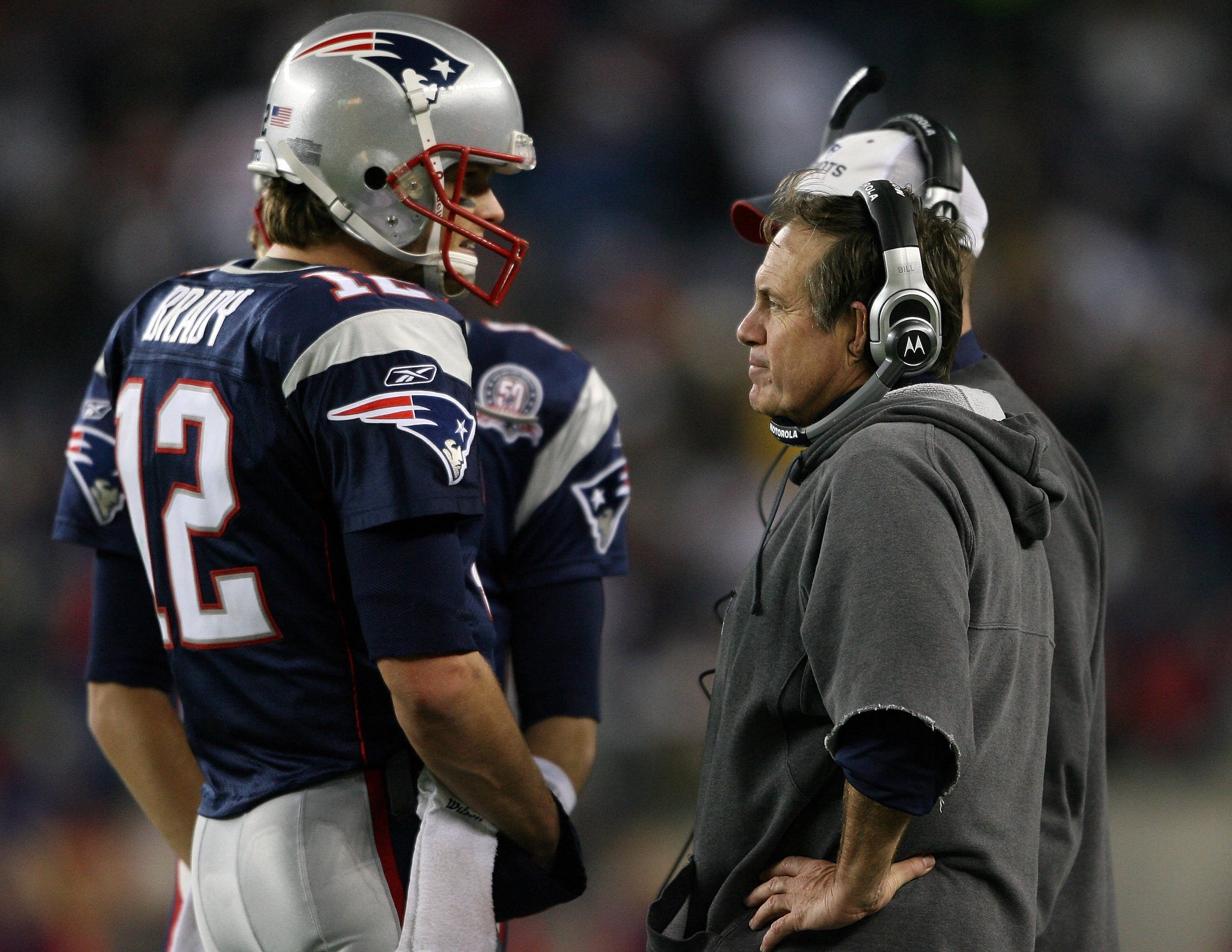 FOXBORO, MA - NOVEMBER 22:  Tom Brady #12 of the New England Patriots talks with head coach Bill Belichick in fourth quarter against the New York Jets on November 22, 2009 at Gillette Stadium in Foxboro, Massachusetts. The Patriots defeated the Jets 31-14