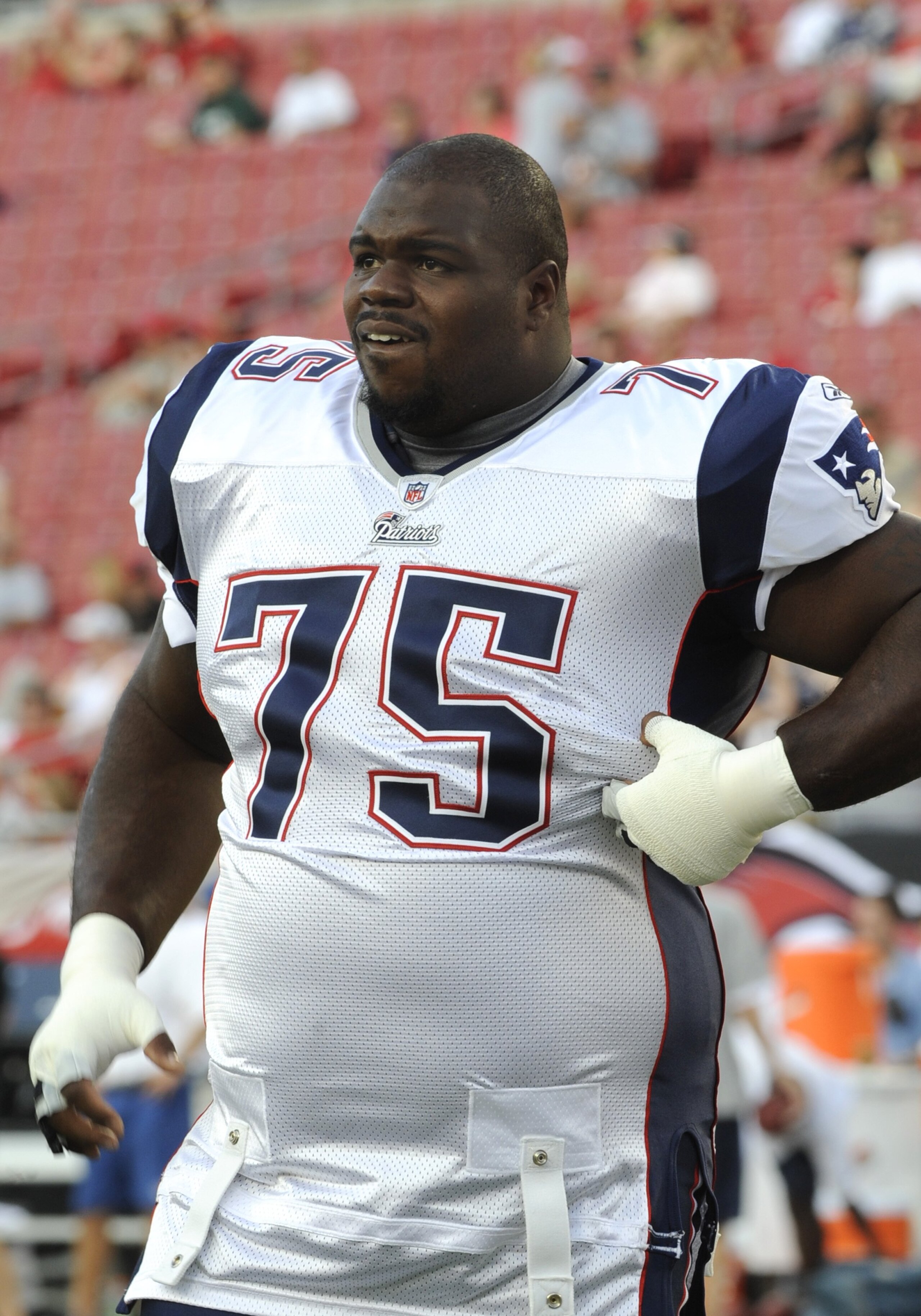 TAMPA, FL - AUGUST 17: Nose tackle Vince Wilfork #75 of the New England Patriots watches play against the Tampa Bay Buccaneers at Raymond James Stadium on August 17, 2008 in Tampa, Florida.   (Photo by Al Messerschmidt/Getty Images)