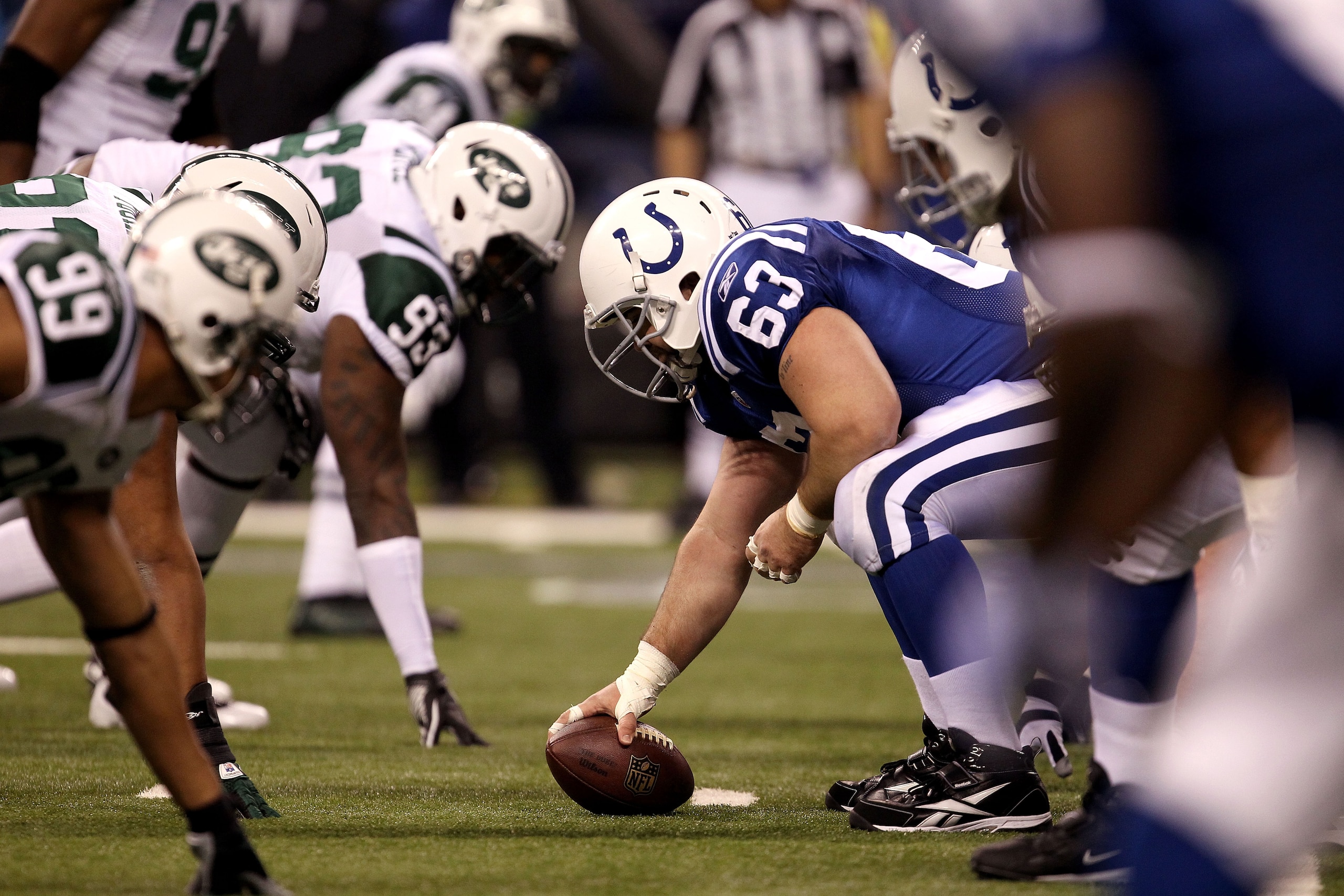 INDIANAPOLIS, IN - JANUARY 08:  Center Jeff Saturday #63 of the Indianapolis Colts readies to snap the ball against the New York Jets during their 2011 AFC wild card playoff game at Lucas Oil Stadium on January 8, 2011 in Indianapolis, Indiana. The Jets w