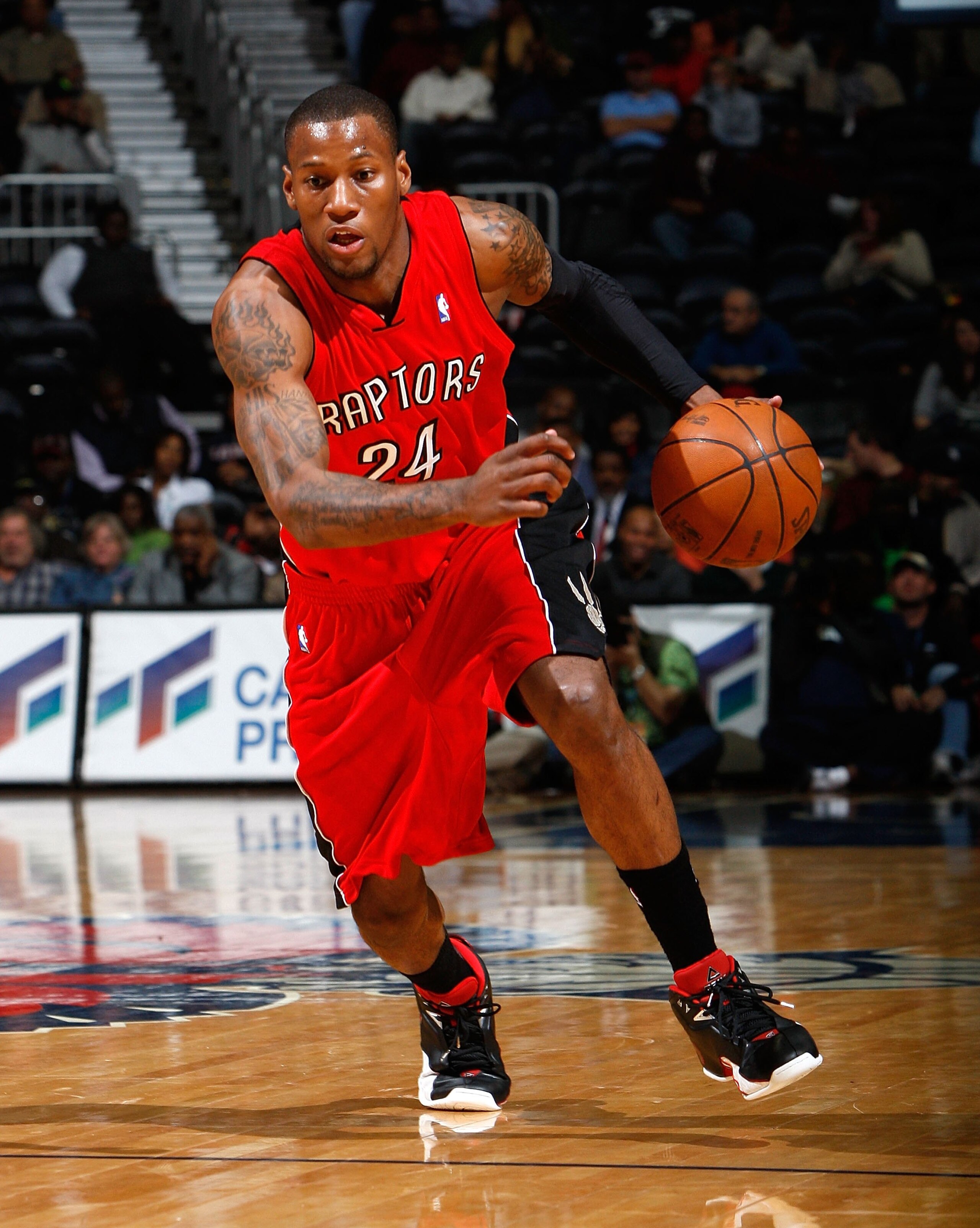 ATLANTA - DECEMBER 02:  Sonny Weems #24 of the Toronto Raptors against the Atlanta Hawks at Philips Arena on December 2, 2009 in Atlanta, Georgia.  NOTE TO USER: User expressly acknowledges and agrees that, by downloading and/or using this Photograph, Use
