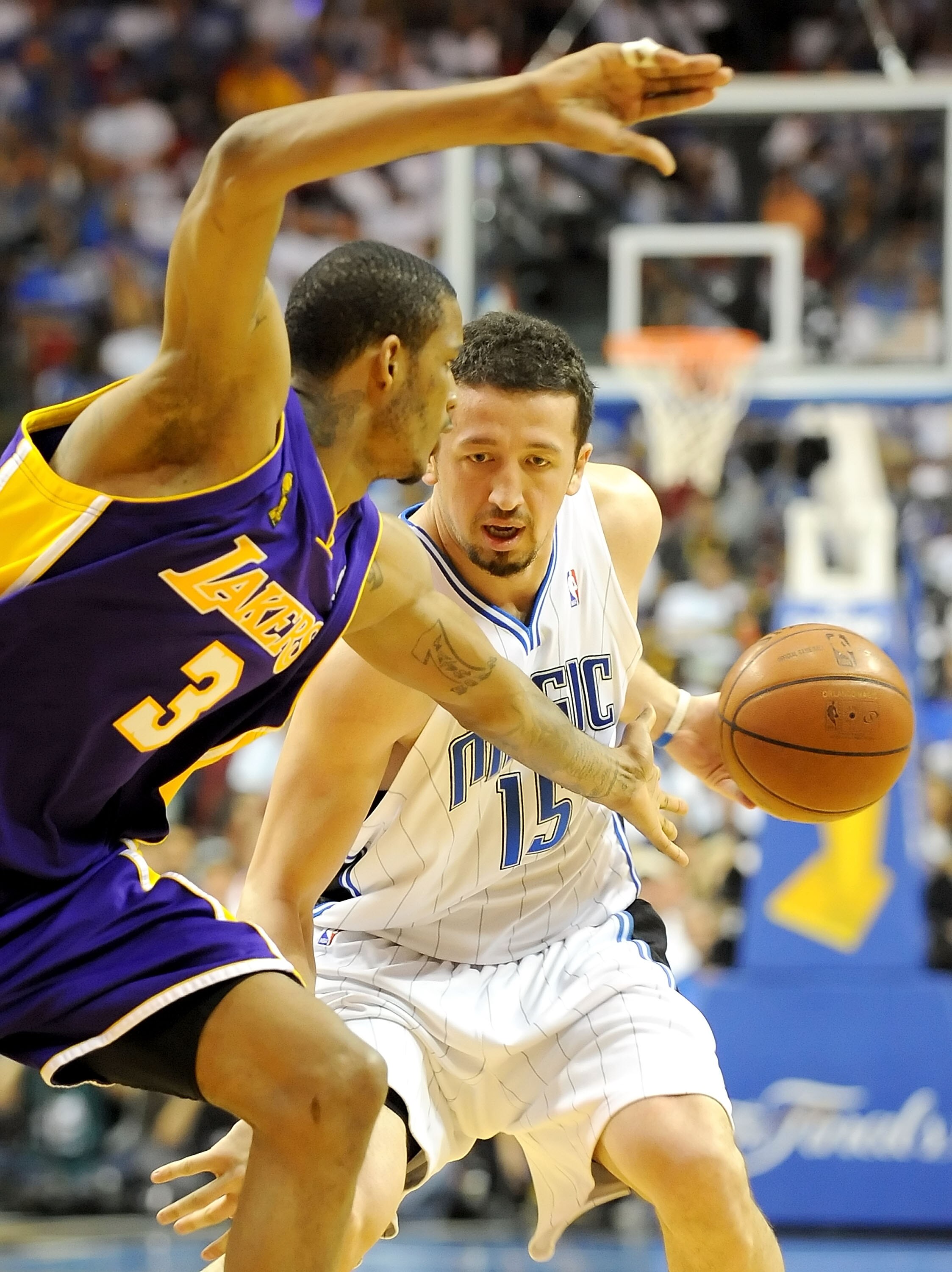 ORLANDO, FL - JUNE 14:  Hedo Turkoglu #15 of the Orlando Magic moves the ball as Trevor Ariza #3 of the Los Angeles Lakers goes for the steal in the third quarter of Game Five of the 2009 NBA Finals on June 14, 2009 at Amway Arena in Orlando, Florida.  NO