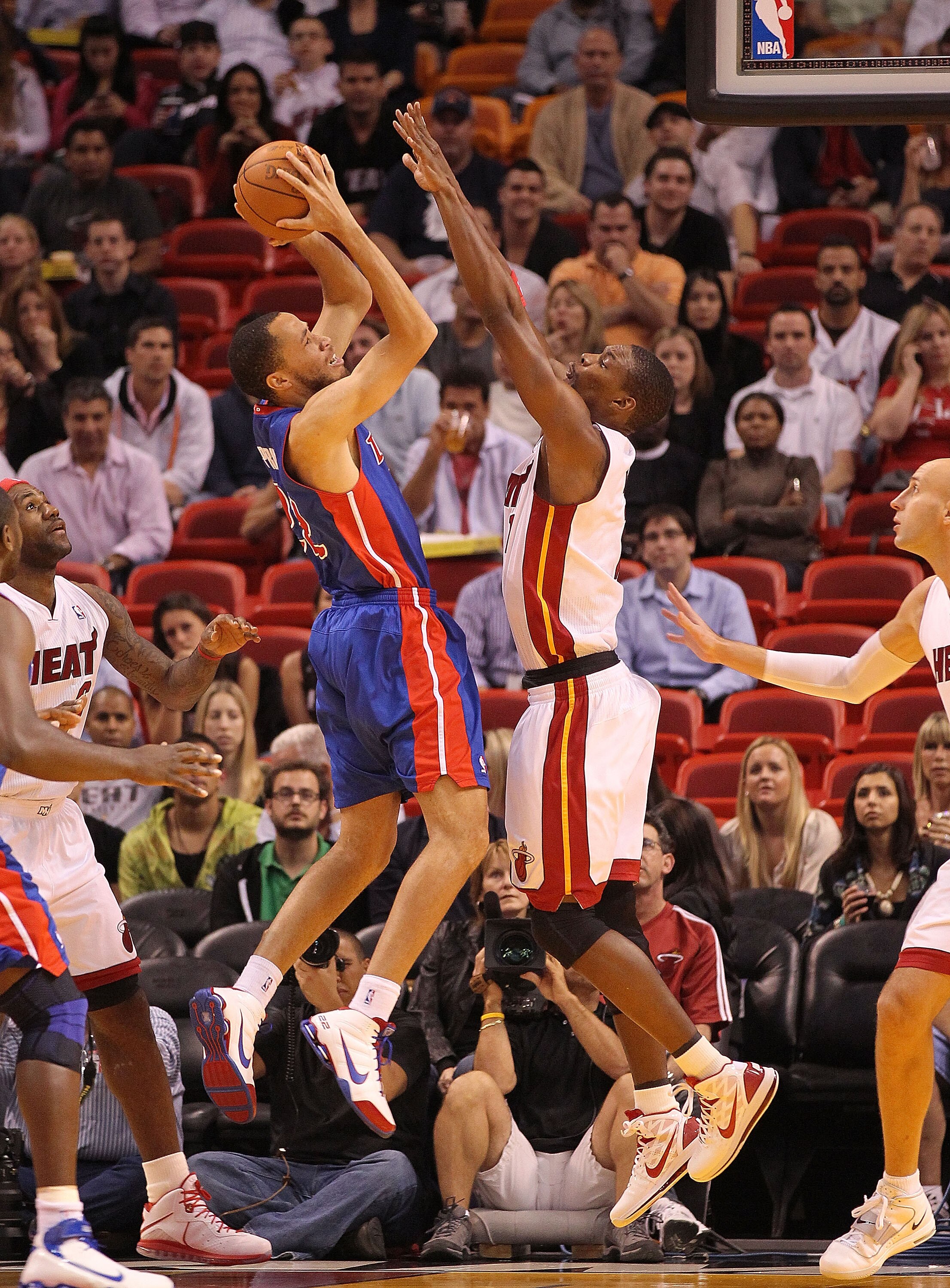 MIAMI, FL - DECEMBER 01: Tayshaun Prince #22 of the Detroit Pistons shoots over Chris Bosh #1 of the Miami Heat during a game at American Airlines Arena on December 1, 2010 in Miami, Florida. NOTE TO USER: User expressly acknowledges and agrees that, by d