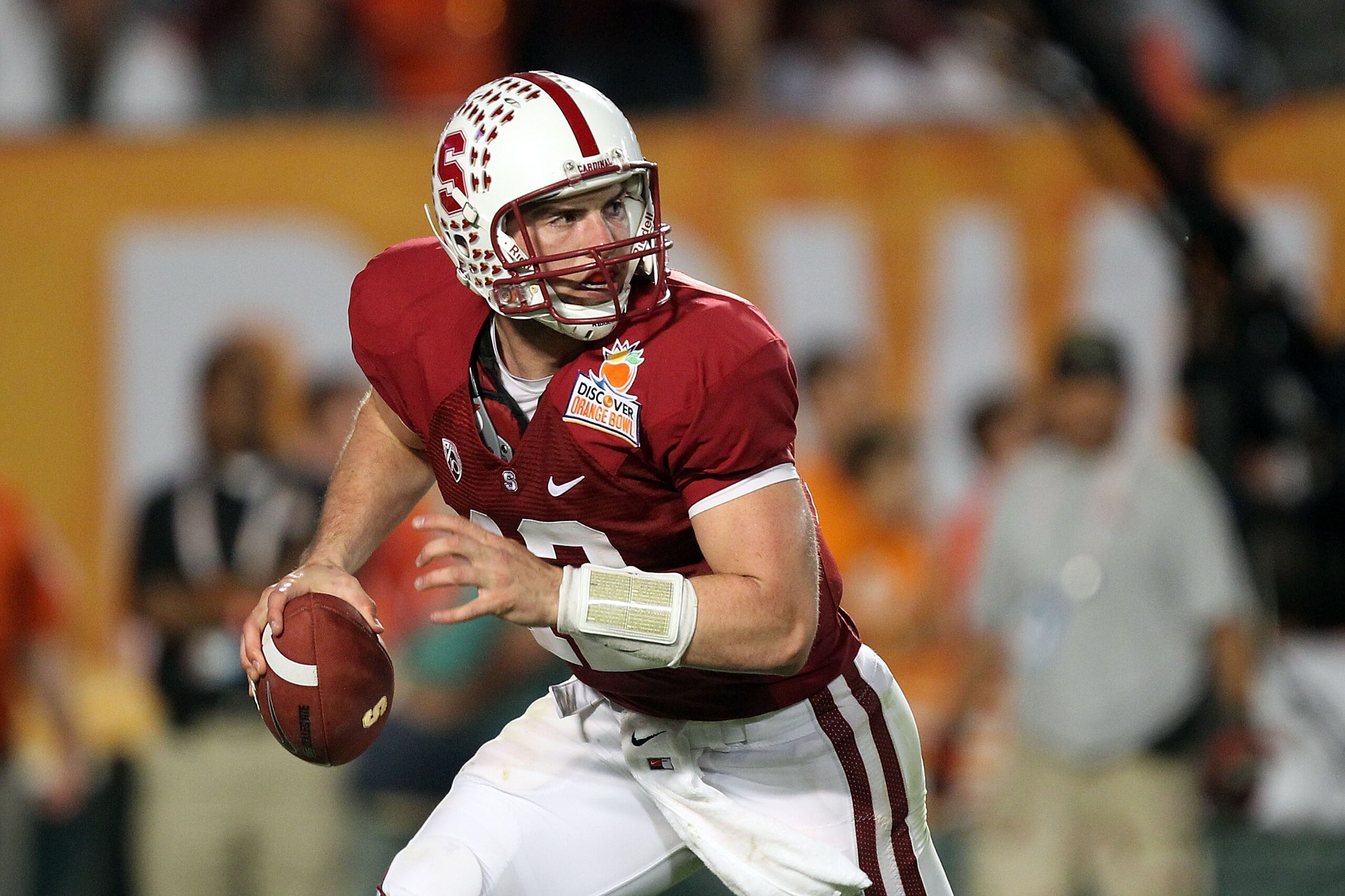 MIAMI, FL - JANUARY 03: Quarterback Andrew Luck #12 of the Stanford Cardinal rolls out of the pocket against the Virginia Tech Hokies during the 2011 Discover Orange Bowl at Sun Life Stadium on January 3, 2011 in Miami, Florida. Stanford won 40-12. (Phot MIAMI, FL - JANUARY 03: Quarterback Andrew Luck #12 of the Stanford Cardinal rolls out of the pocket against the Virginia Tech Hokies during the 2011 Discover Orange Bowl at Sun Life Stadium on January 3, 2011 in Miami, Florida. Stanford won 40-12. (Phot