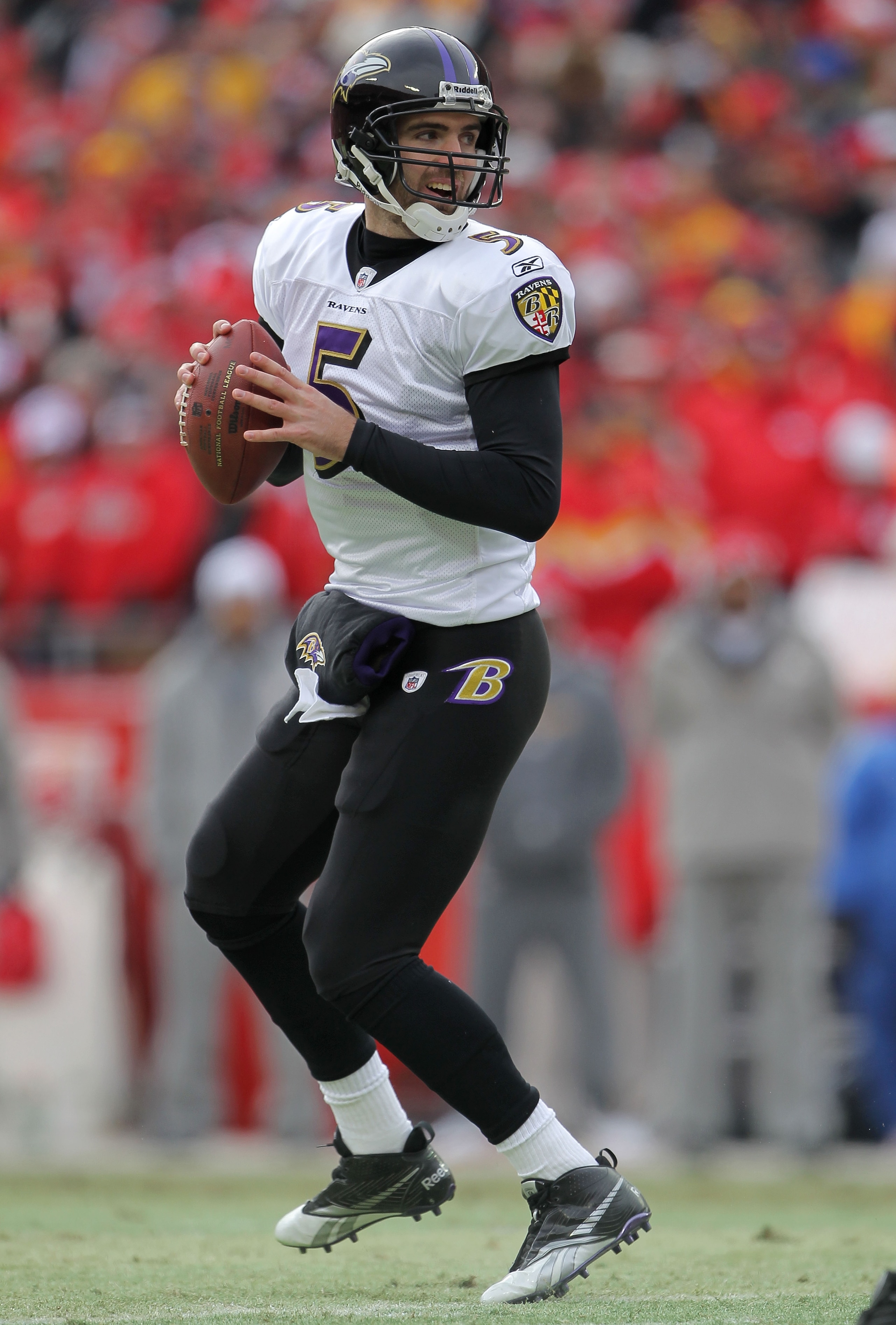 KANSAS CITY, MO - JANUARY 09:  Quarterback Joe Flacco #5 of the Baltimore Ravens looks to pass against the Kansas City Chiefs in their 2011 AFC wild card playoff game at Arrowhead Stadium on January 9, 2011 in Kansas City, Missouri.  (Photo by Doug Pensin
