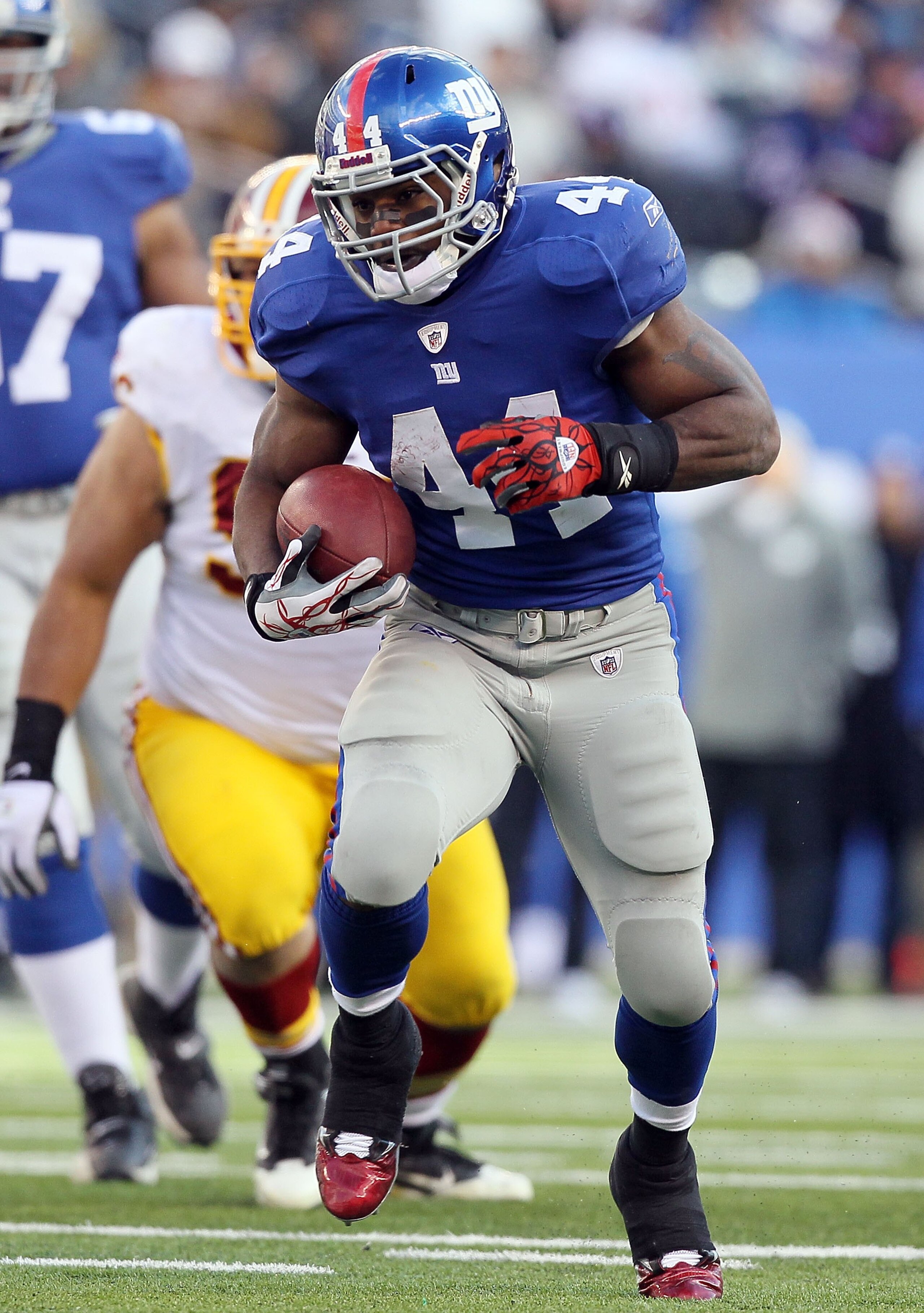 EAST RUTHERFORD, NJ - DECEMBER 05:  Ahmad Bradshaw #44 of the New York Giants runs the ball against the Washington Redskins on December 5, 2010 at the New Meadowlands Stadium in East Rutherford, New Jersey. The Giants defeated the Redskins 31-7.  (Photo b