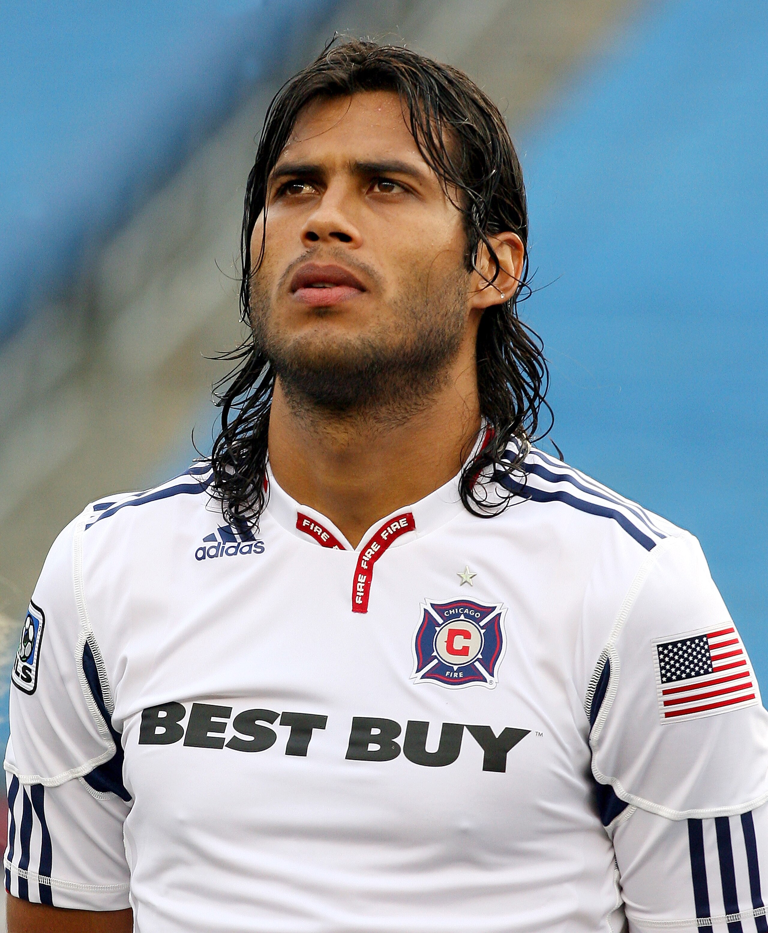 FOXBORO, MA - JUNE 27:  Wilman Conde #22 of the Chicago Fire stands for the national anthem before a game against the New England Revolution at Gillette Stadium on June 27, 2010 in Foxboro, Massachusetts. (Photo by Gail Oskin/Getty Images)