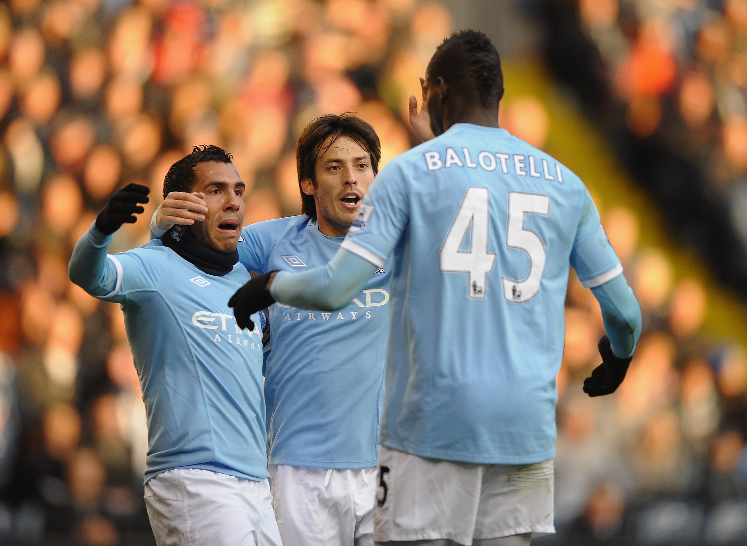 WEST BROMWICH, ENGLAND - NOVEMBER 07: Carlos Tevez and David Silva of Manchester City rush to congratulate Mario Balotelli on his opening goal during the Barclays Premier League match between West Bromwich Albion and Manchester City at The Hawthorns on No