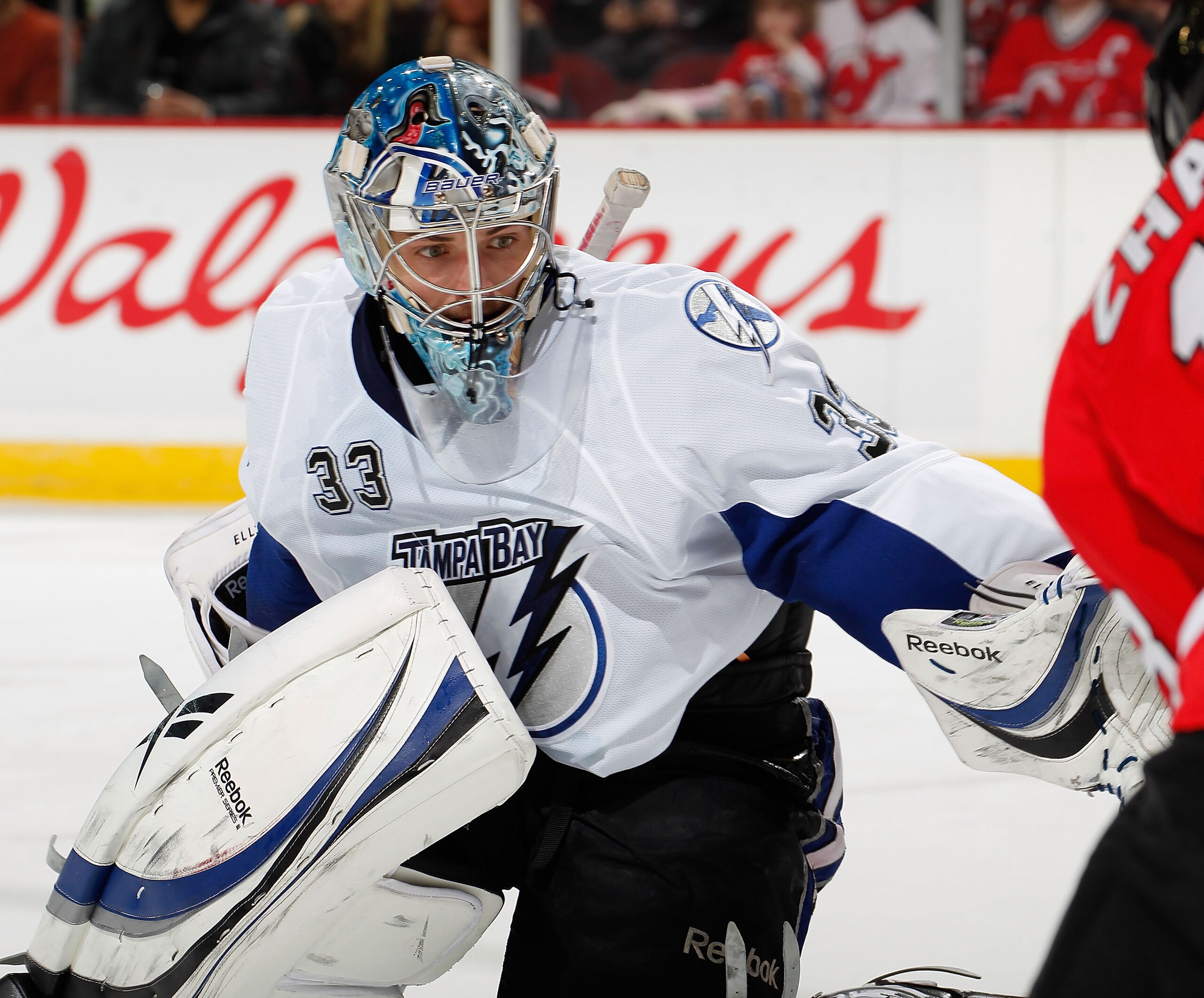NEWARK, NJ - JANUARY 09:  Goalie Dan Ellis #33 of the Tampa Bay Lightning follows the puck during an NHL hockey game against the New Jersey Devils at the Prudential Center on January 9, 2011 in Newark, New Jersey.  (Photo by Paul Bereswill/Getty Images)