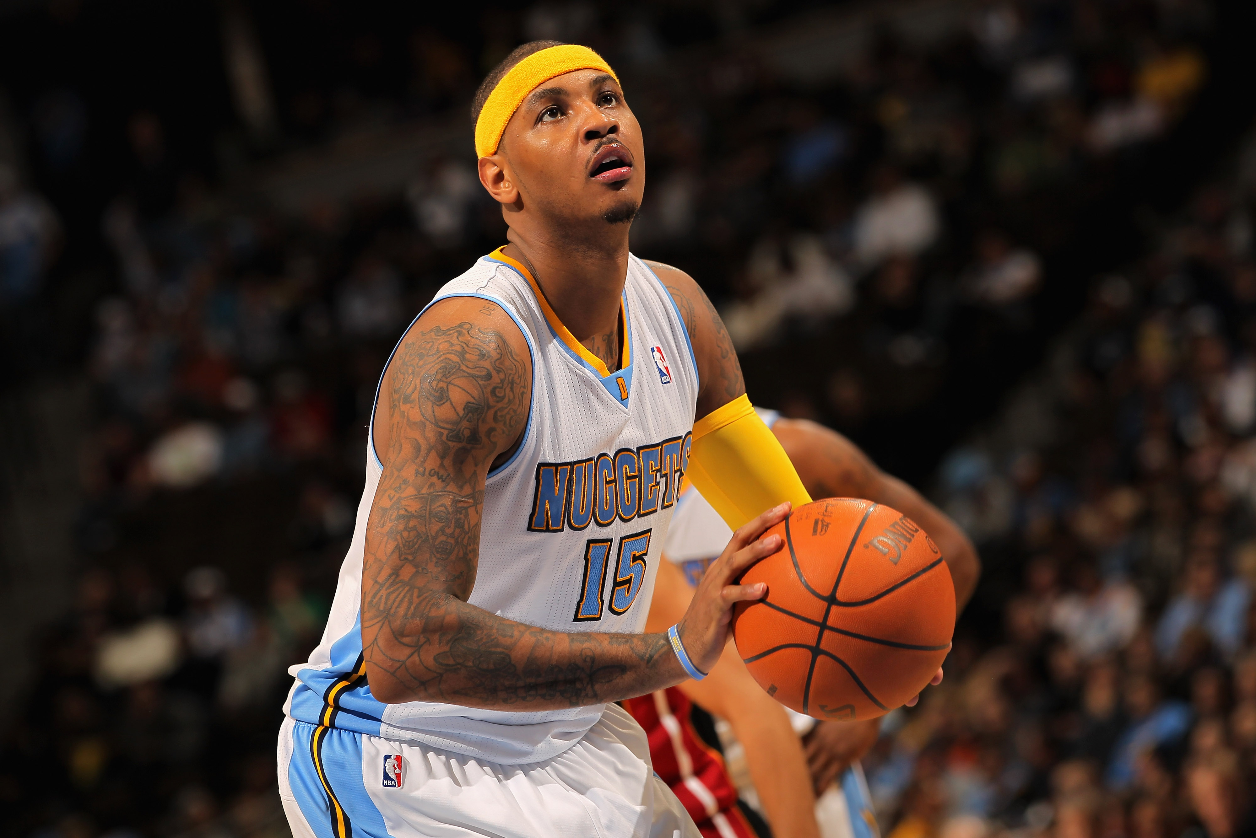 DENVER, CO - JANUARY 13:  Carmelo Anthony #15 of the Denver Nuggets takes a free throw against the Miami Heat at the Pepsi Center on January 13, 2011 in Denver, Colorado. The Nuggets defeated the Heat 130-102. NOTE TO USER: User expressly acknowledges and