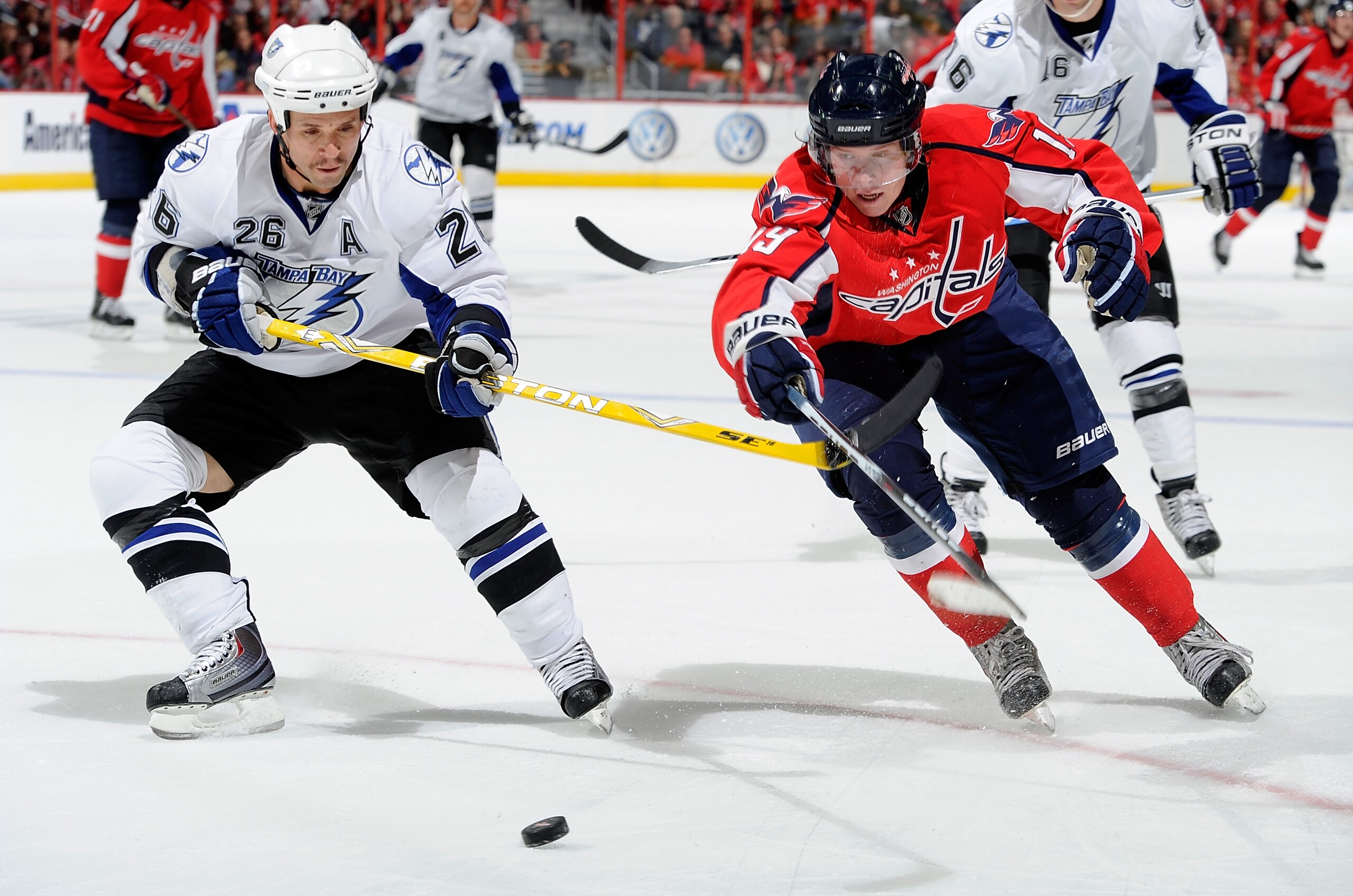 WASHINGTON - NOVEMBER 26:  Nicklas Backstrom #19 of the Washington Capitals battles for the puck with Martin St Louis #26 of the Tampa Bay Lightning at the Verizon Center on November 26, 2010 in Washington, DC.  (Photo by Greg Fiume/Getty Images)
