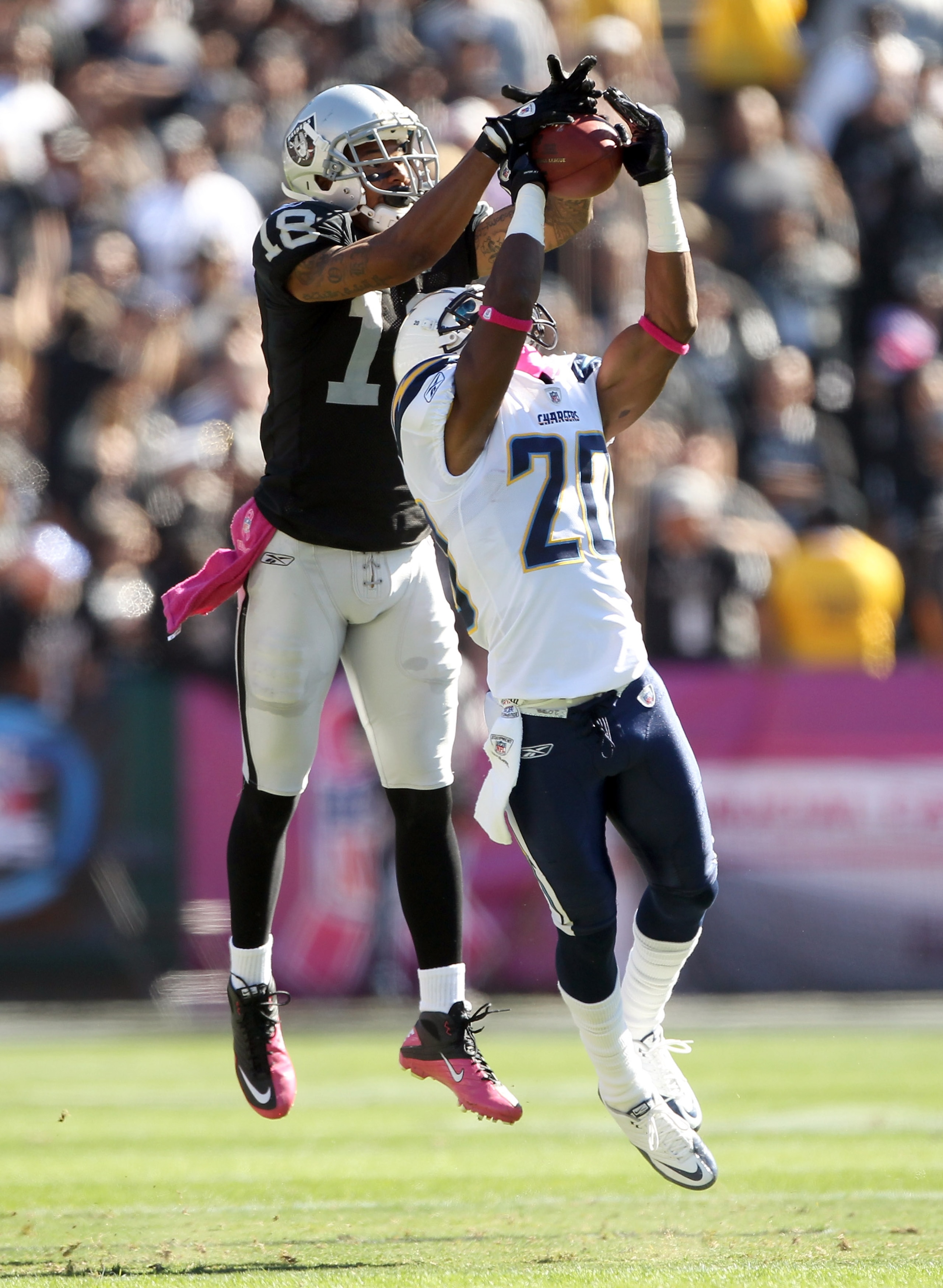 OAKLAND, CA - OCTOBER 10:  Antoine Cason #20 of the San Diego Chargers breaks up a pass intended for Louis Murphy #18 of the Oakland Raiders at Oakland-Alameda County Coliseum on October 10, 2010 in Oakland, California.  (Photo by Ezra Shaw/Getty Images)