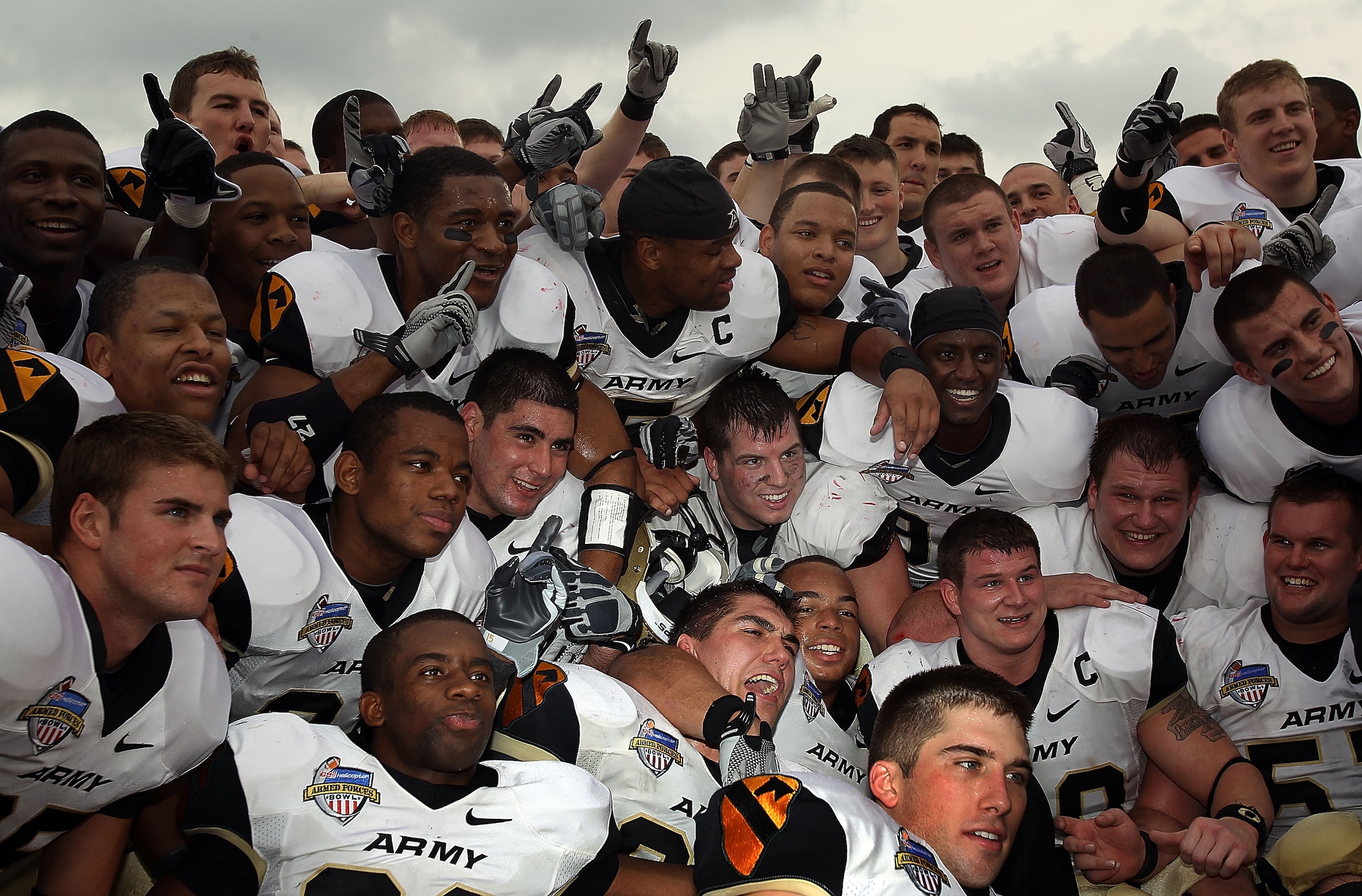 DALLAS, TX - DECEMBER 30:  The Army Black Knights celebrate a 16-14 win against the SMU Mustangs during the Bell Helicopter Armed Forces Bowl at Gerald J. Ford Stadium on December 30, 2010 in Dallas, Texas.  (Photo by Ronald Martinez/Getty Images)