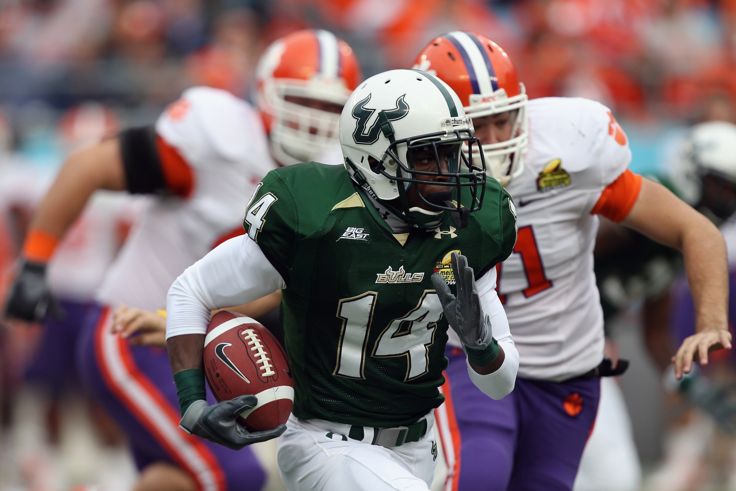 CHARLOTTE, NC - DECEMBER 31:  Terrence Mitchell #14 of the USF Bulls runs with the ball against the Clemson Tigers during their game at Bank of America Stadium on December 31, 2010 in Charlotte, North Carolina.  (Photo by Streeter Lecka/Getty Images)