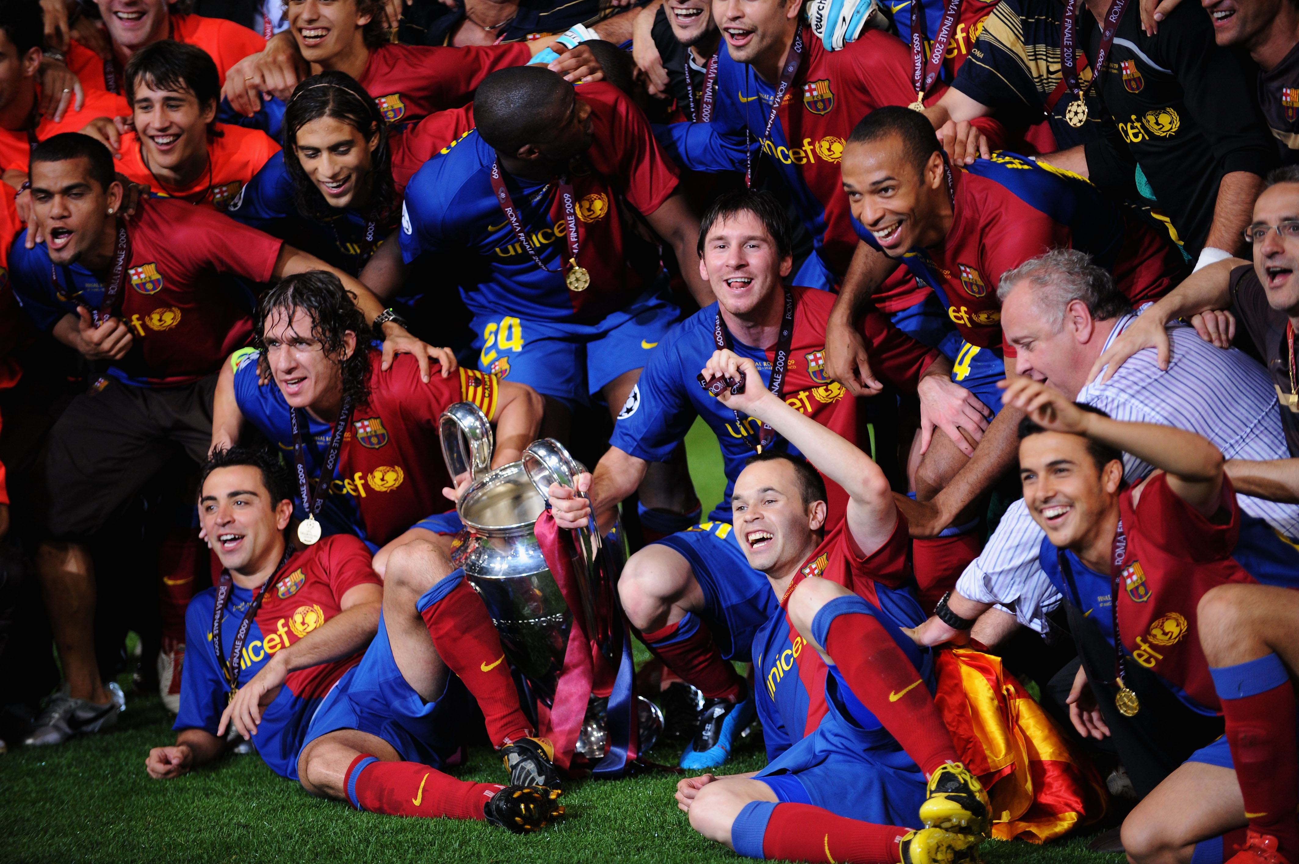 ROME - MAY 27:  Barcelona players pose in front of the trophy after they celebrate winning the UEFA Champions League Final match between Barcelona and Manchester United at the Stadio Olimpico on May 27, 2009 in Rome, Italy. Barcelona won 2-0.  (Photo by S