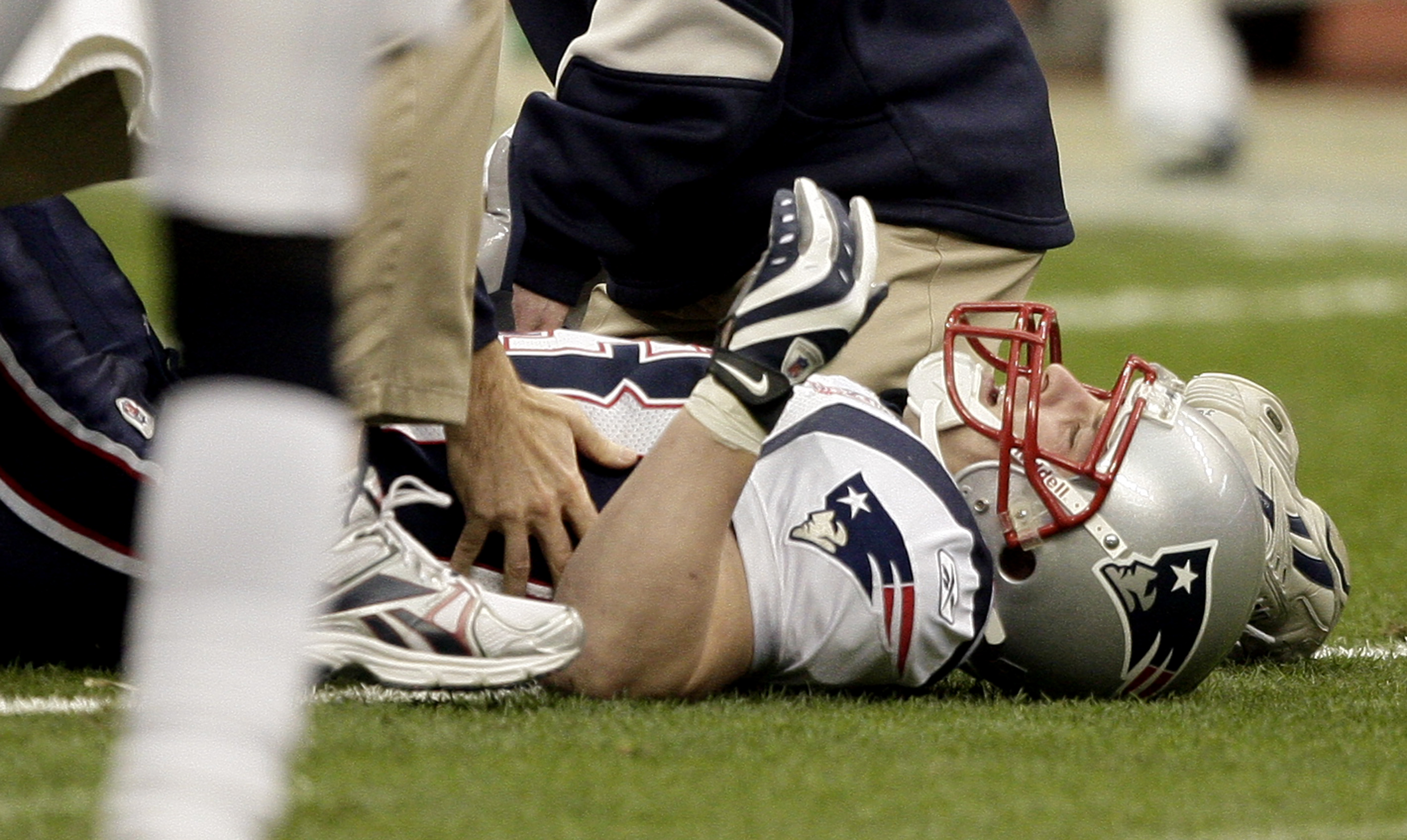 HOUSTON - JANUARY 03:  Wide receiver Wes Welker #83 of the New England Patriots is tended to by medical personnel after injuring his leg against the Houston Texans at Reliant Stadium on January 3, 2010 in Houston, Texas.  (Photo by Bob Levey/Getty Images)