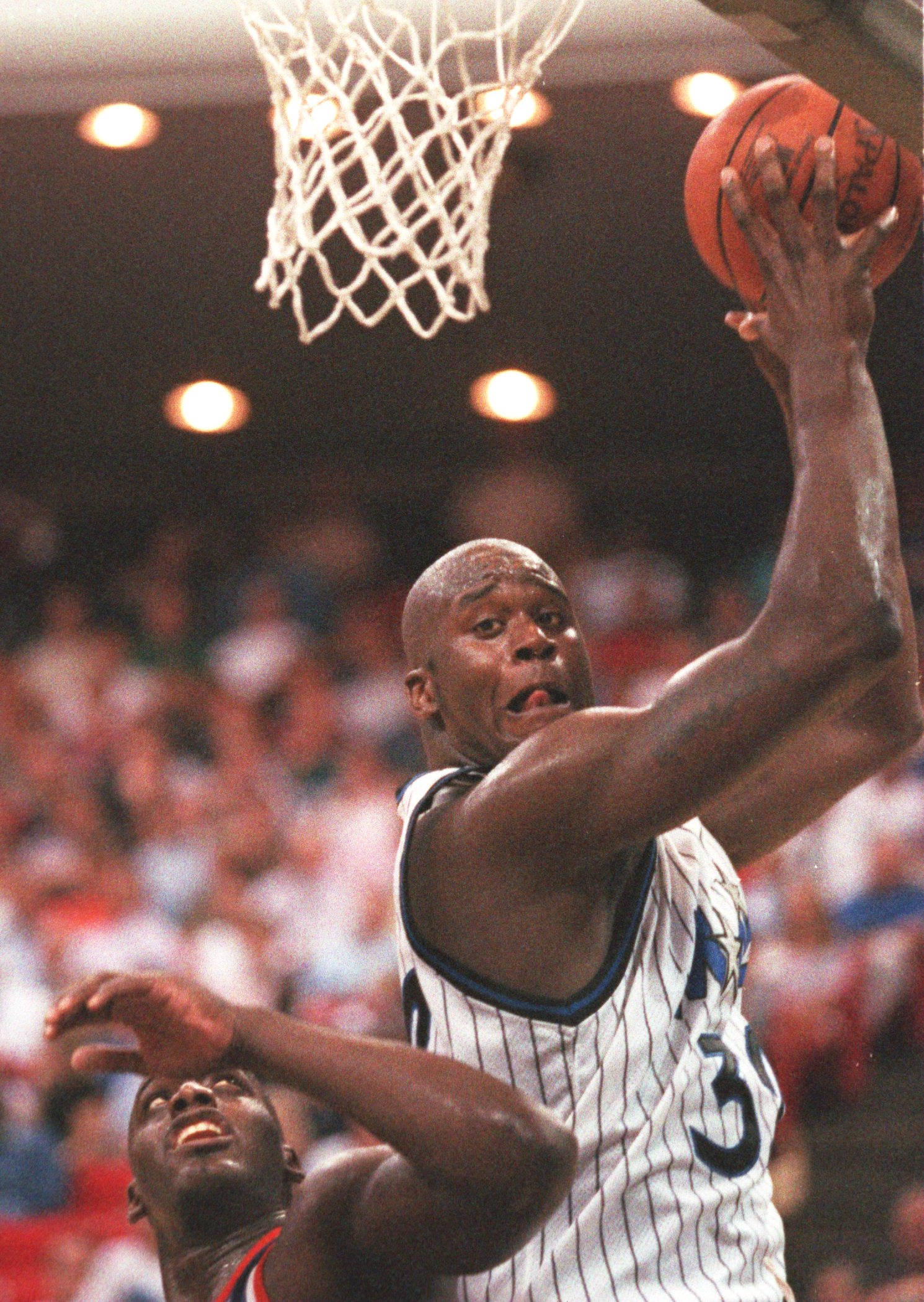 10 NOV 1994:  SHAQUILLE O''NEAL OF THE ORLANDO MAGIC PULLS DOWN A REBOUND DURING A 101-99 LOSS TO THE NEW YORK KNICKS IN ORLANDO, FLORIDA.     Mandatory Credit: ALLSPORT