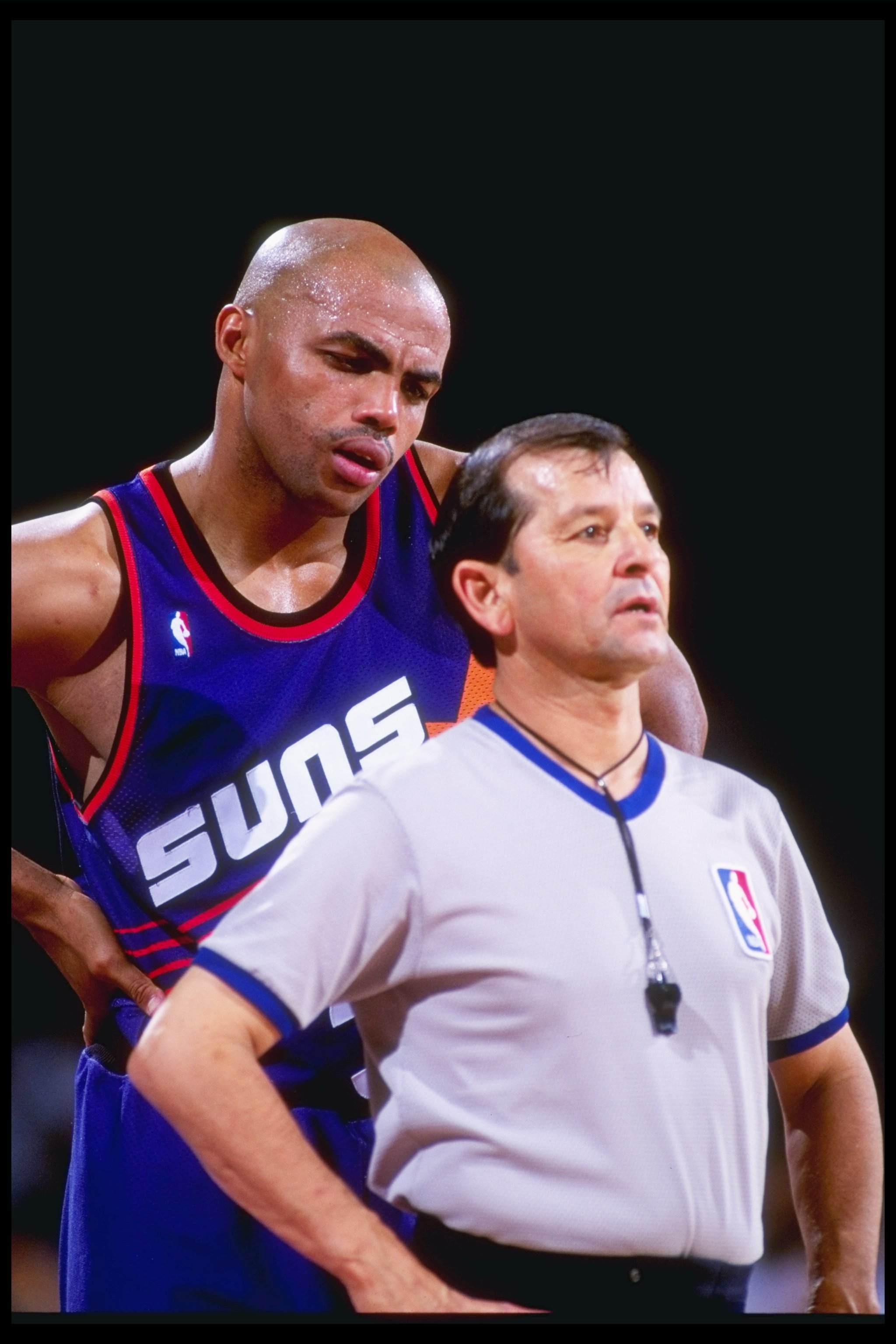1992-1993:  Forward Charles Barkley of the Phoenix Suns confers with an official during a game against the Denver Nuggets at McNichols Arena in Denver, Colorado. Mandatory Credit: Tim DeFrisco  /Allsport