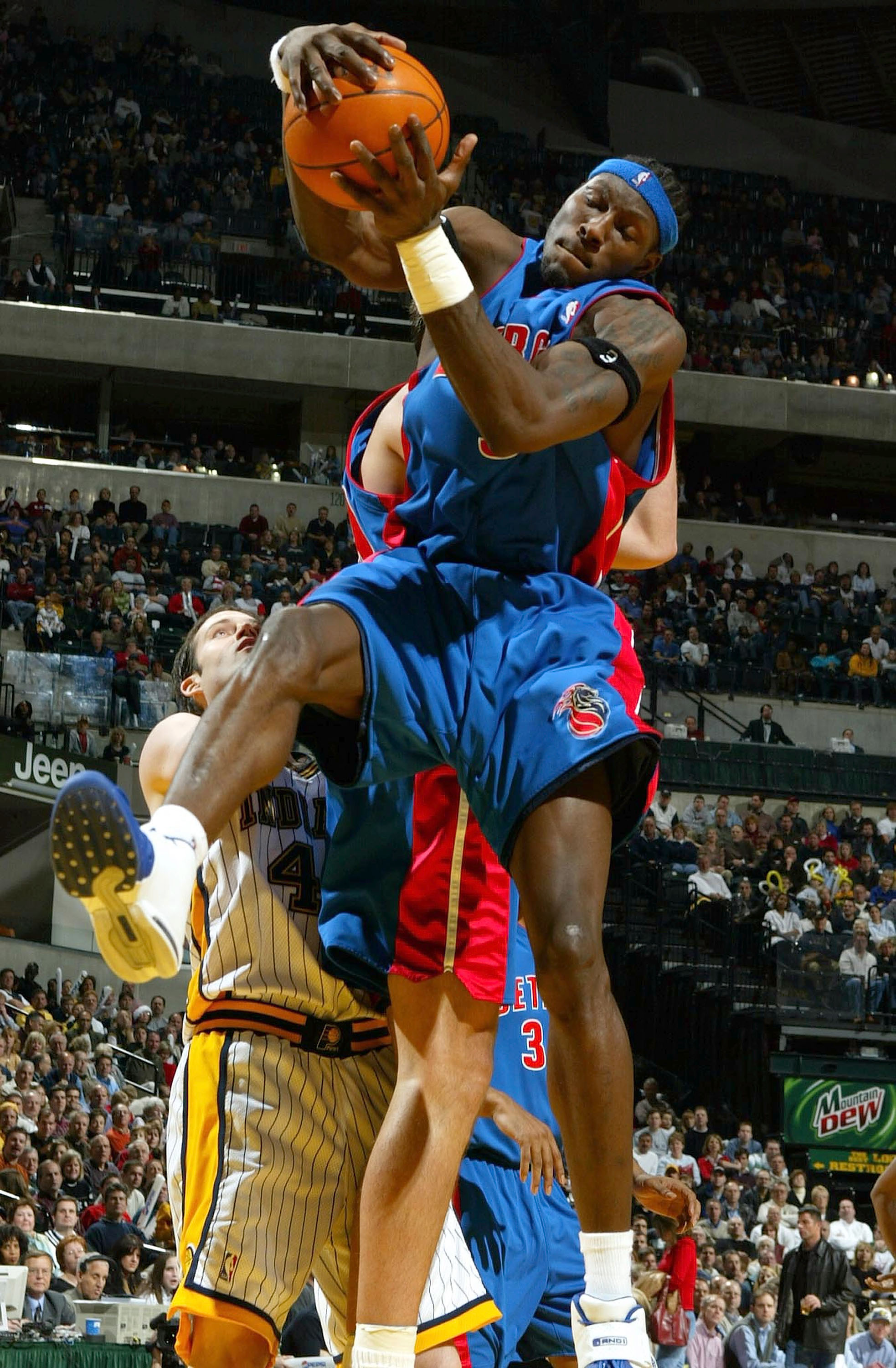 INDIANAPOLIS - DECEMBER 19:  Ben Wallace #3 of the Detroit Pistons grabs a rebound against the Indiana Pacers on December19, 2003 at Conseco Fieldhouse in Indianapolis, Indiana. NOTE TO USER: User expressly acknowledges and agress that, by downloading and