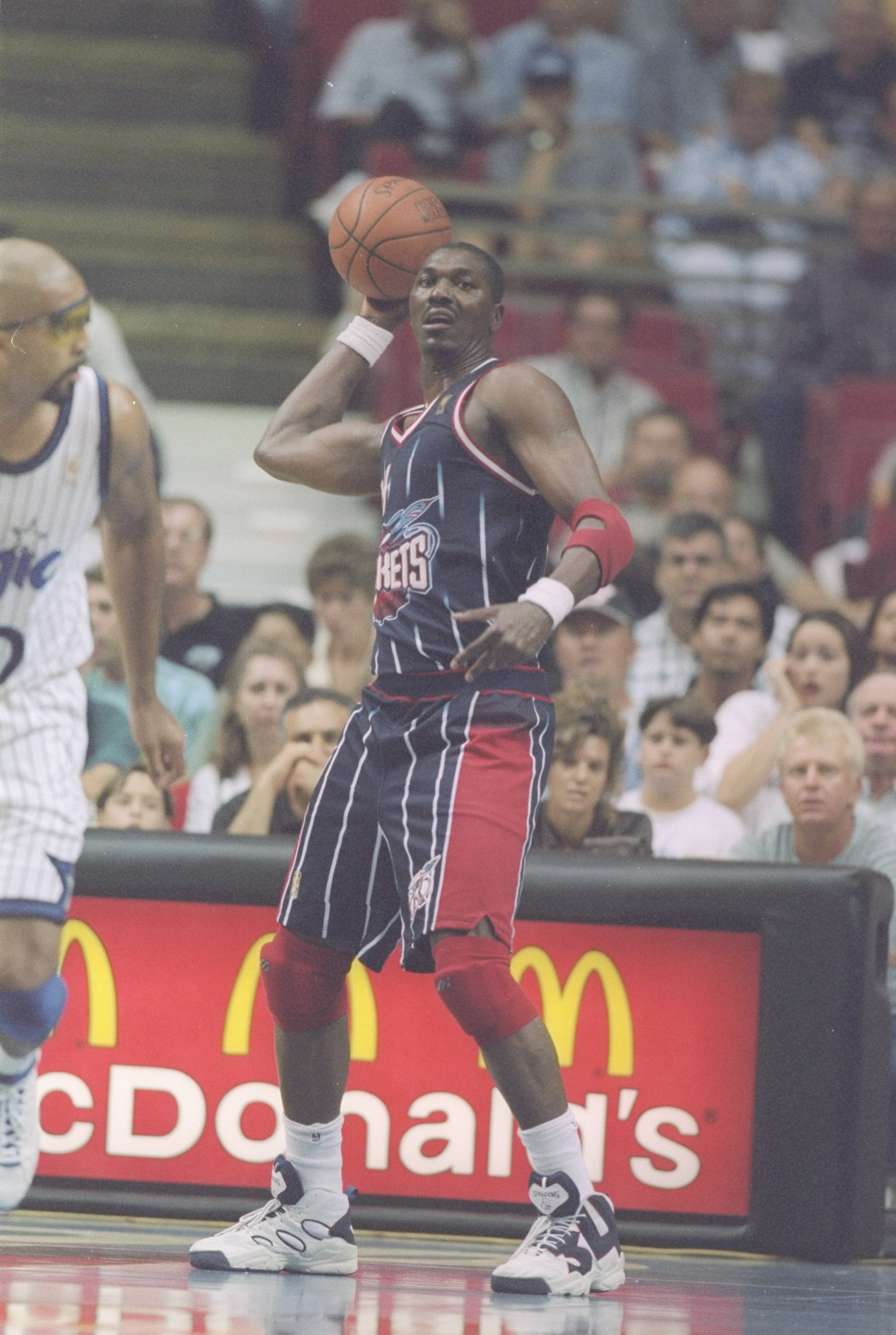 18 Oct 1996: Center Hakeem Olajuwom of the Houston Rockets prepares to pass the ball during a game against the Orlando Magic at Orlando Arena in Orlando, Florida. The Magic won the game 95 - 83.