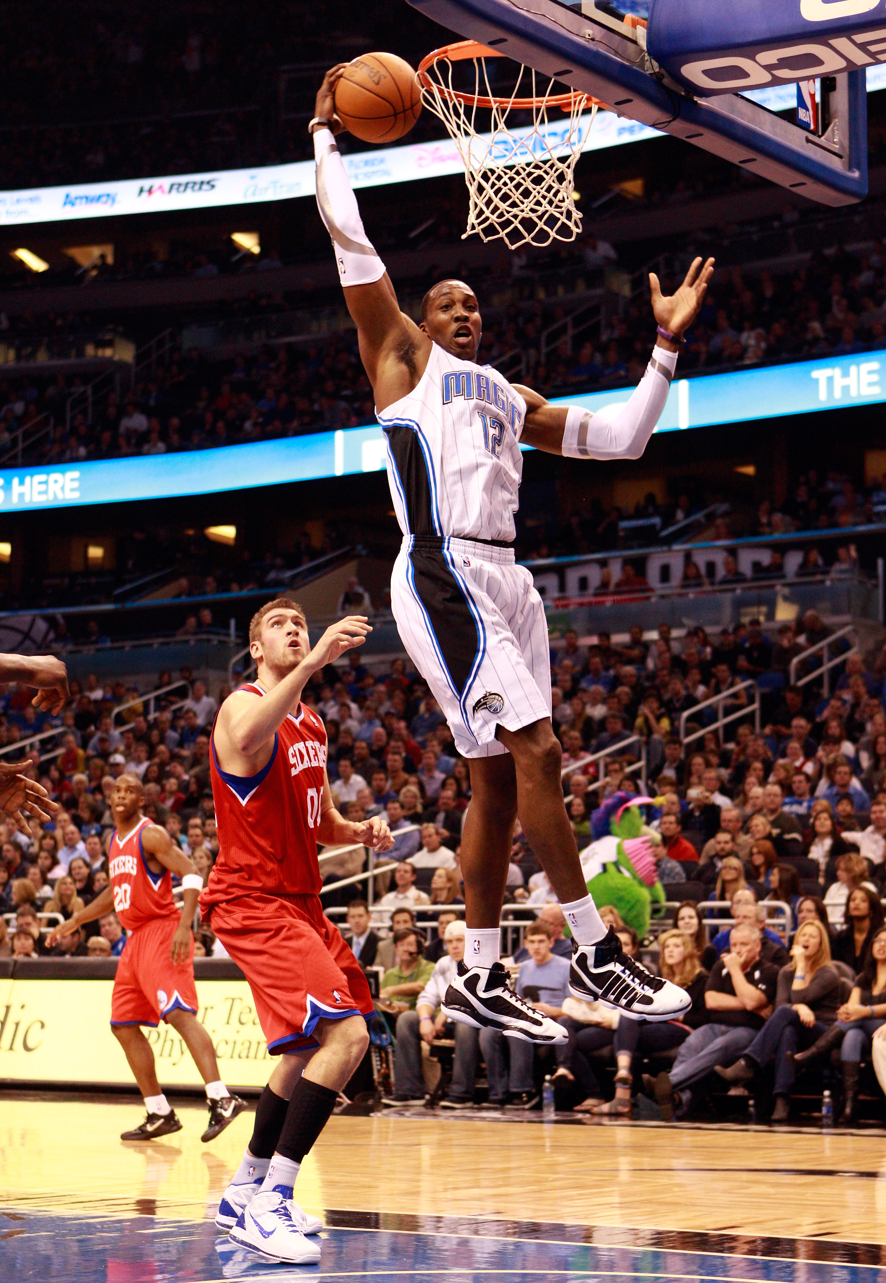 ORLANDO, FL - DECEMBER 18:  Dwight Howard #12 of the Orlando Magic attempts a shot during the game against the Philadelphia 76ers at Amway Arena on December 18, 2010 in Orlando, Florida.  NOTE TO USER: User expressly acknowledges and agrees that, by downl