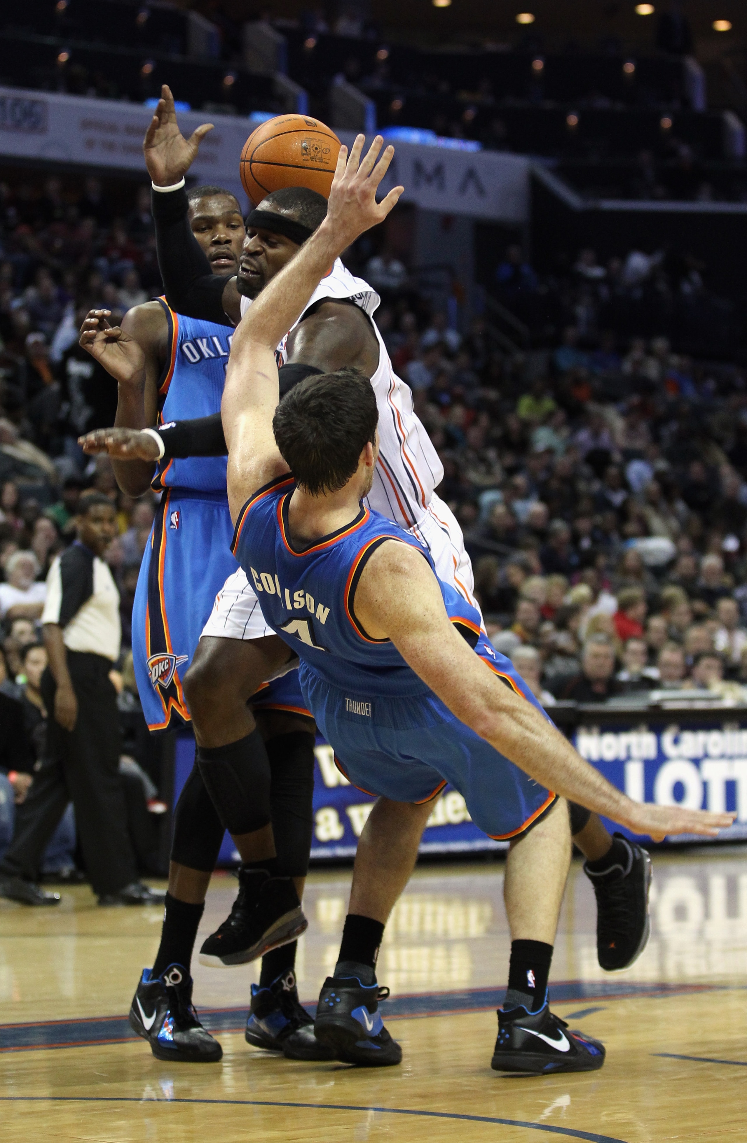 CHARLOTTE, NC - DECEMBER 21: Teammates Kevin Durant #35 and Nick Collison #4 of the Oklahoma Thunder try to stop Stephen Jackson #1 of the Charlotte Bobcats during their game at Time Warner Cable Arena on December 21, 2010 in Charlotte, North Carolina. N CHARLOTTE, NC - DECEMBER 21: Teammates Kevin Durant #35 and Nick Collison #4 of the Oklahoma Thunder try to stop Stephen Jackson #1 of the Charlotte Bobcats during their game at Time Warner Cable Arena on December 21, 2010 in Charlotte, North Carolina. N