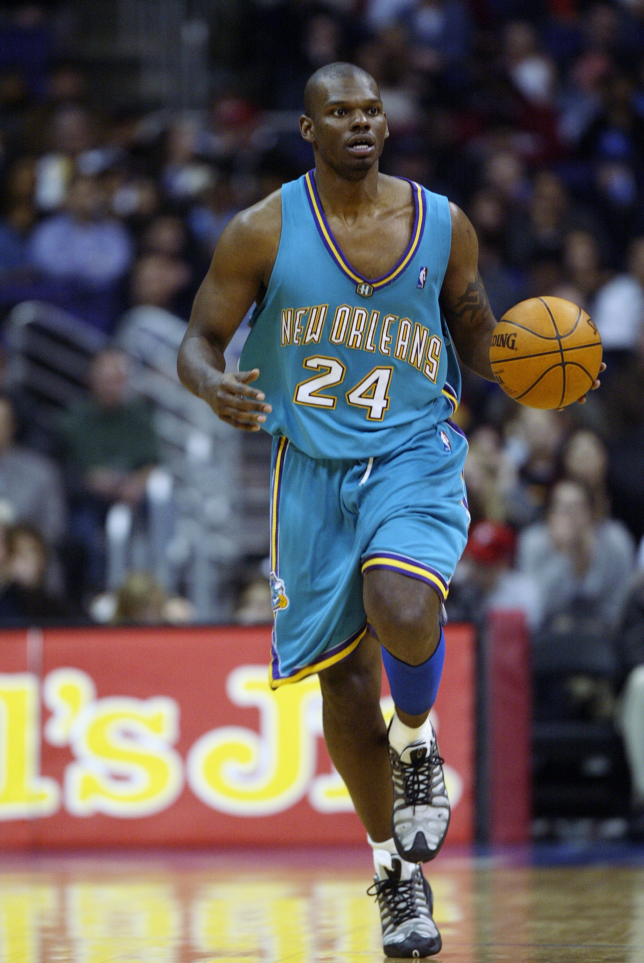 LOS ANGELES - MARCH 3:  Jamal Mashburn #24 of the New Orleans Hornets moves upcourt during the NBA game against the Los Angeles Clippers on March 3, 2003 at Staples Center in Los Angeles, California.  The Hornets won 111-108.  NOTE TO USER: User expressly