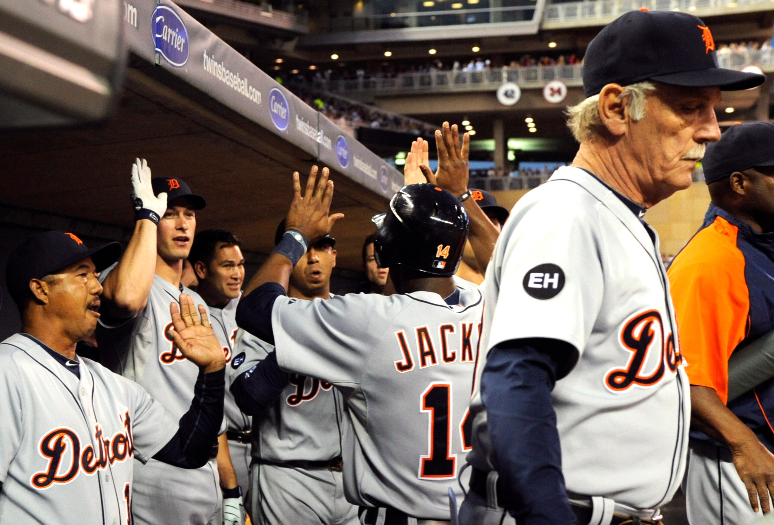MINNEAPOLIS, MN - JUNE 28:  Detroit Tigers celebrate as Austin Jackson #14 returns to the dugout after scoring on a Ryan Raburn single in the seventh inning against the Minnesota Twins during their game on June 28, 2010 at Target Field in Minneapolis, Min