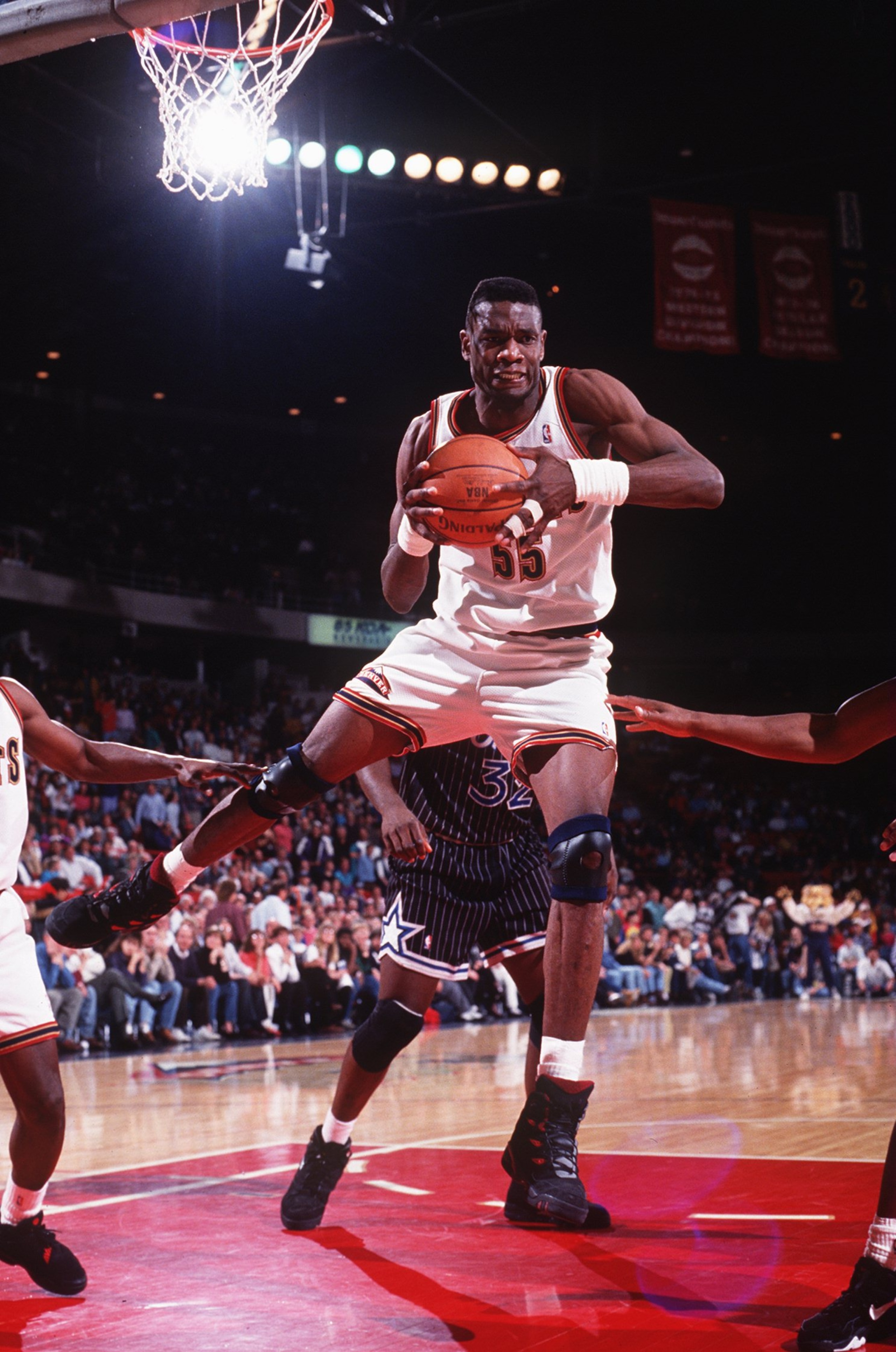 6 MAR 1994:  DENVER CENTER DIKEMBE MUTOMBO GRABS THE REBOUND DURING THE NUGGETS GAME AGAINST THE MINNESOTA TIMBERWOLVES. Mandatory Credit: Tim Defrisco/ALLSPORT