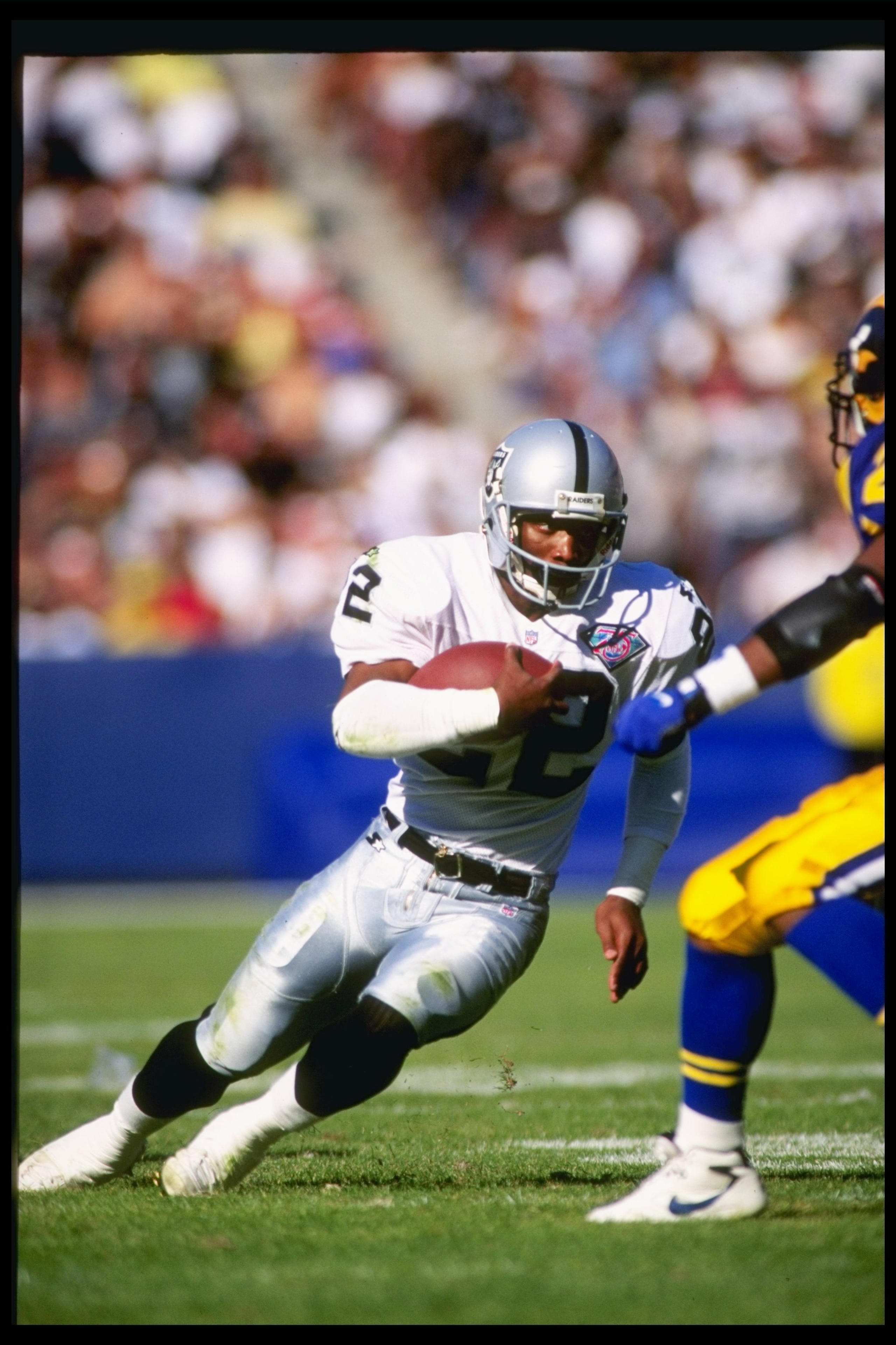 13 Nov 1994:  Running back Harvey Williams of the Los Angeles Raiders moves the ball during a game against the Los Angeles Rams at the Anaheim Stadium in Anaheim, California.  The Raiders won the game, 20-17. Mandatory Credit: Stephen Dunn  /Allsport