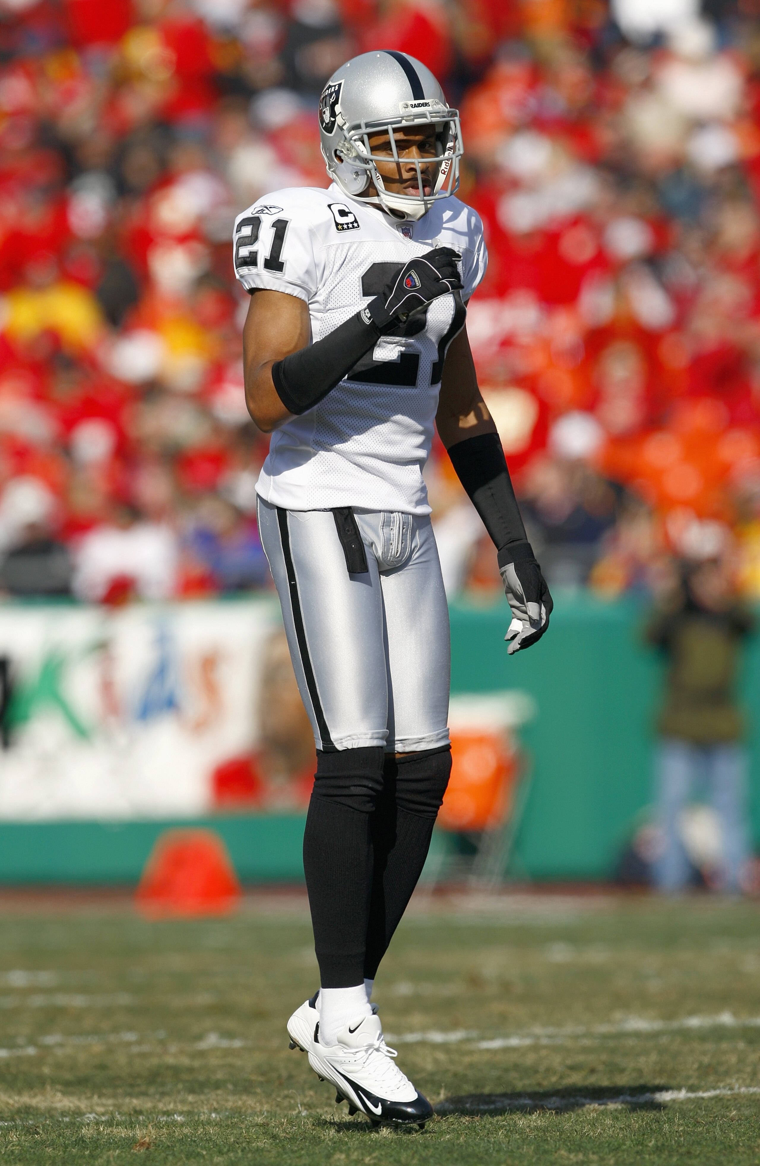 KANSAS CITY, MO - NOVEMBER 25: Nnamdi Asomugha #21of the Oakland Raiders hops on the field during the game against the Kansas City Chiefs November 25, 2007 at Arrowhead Stadium in Kansas City, Missouri. (Photo by Jamie Squire/Getty Images)