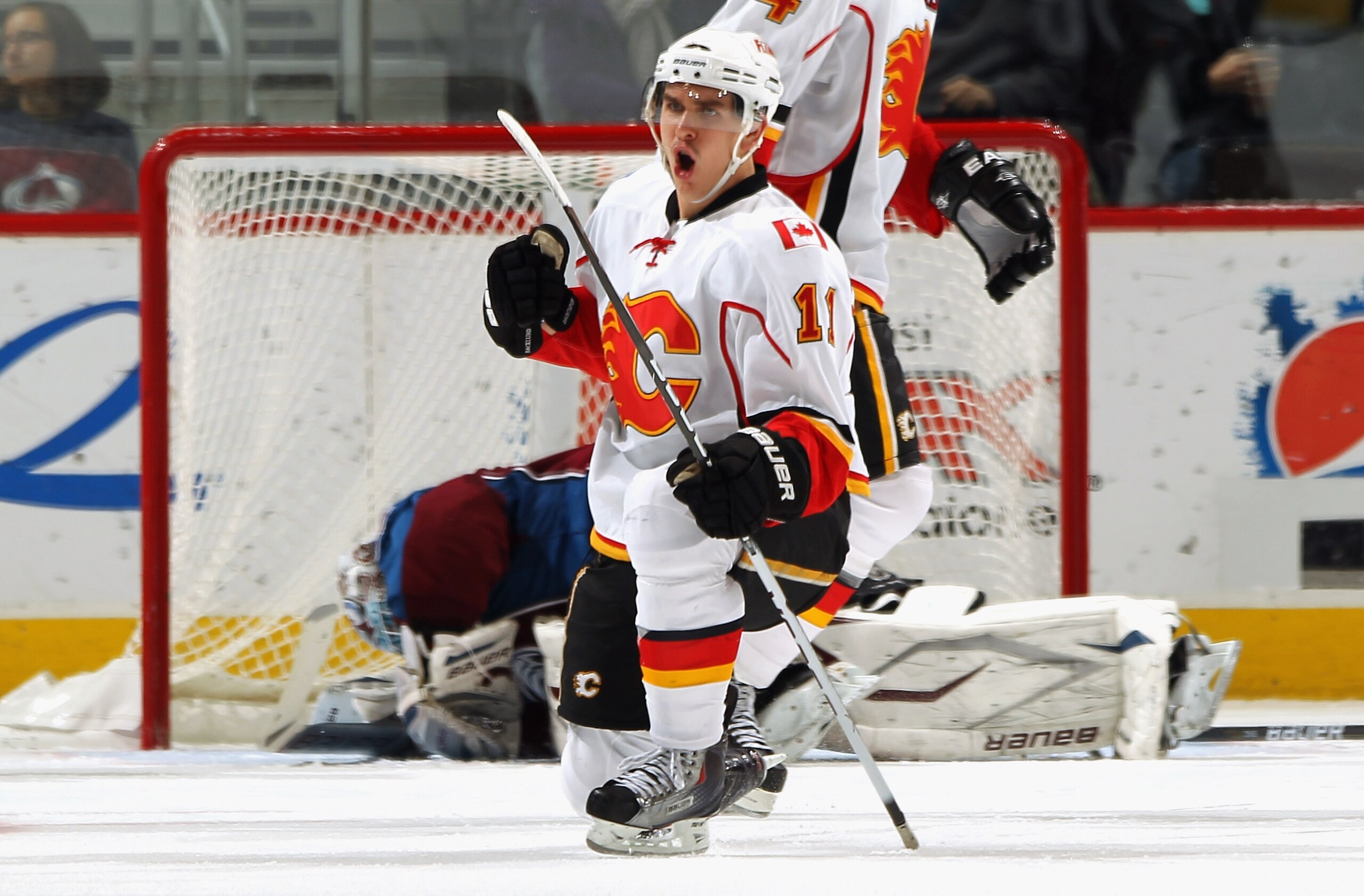 DENVER - NOVEMBER 09:  Mikael Backlund #11 of the Calgary Flames celebrates his third period goal against goalie Peter Budaj #31 of the Colorado Avalanche to tie the score 2-2 at the Pepsi Center on November 9, 2010 in Denver, Colorado. The Flames defeate