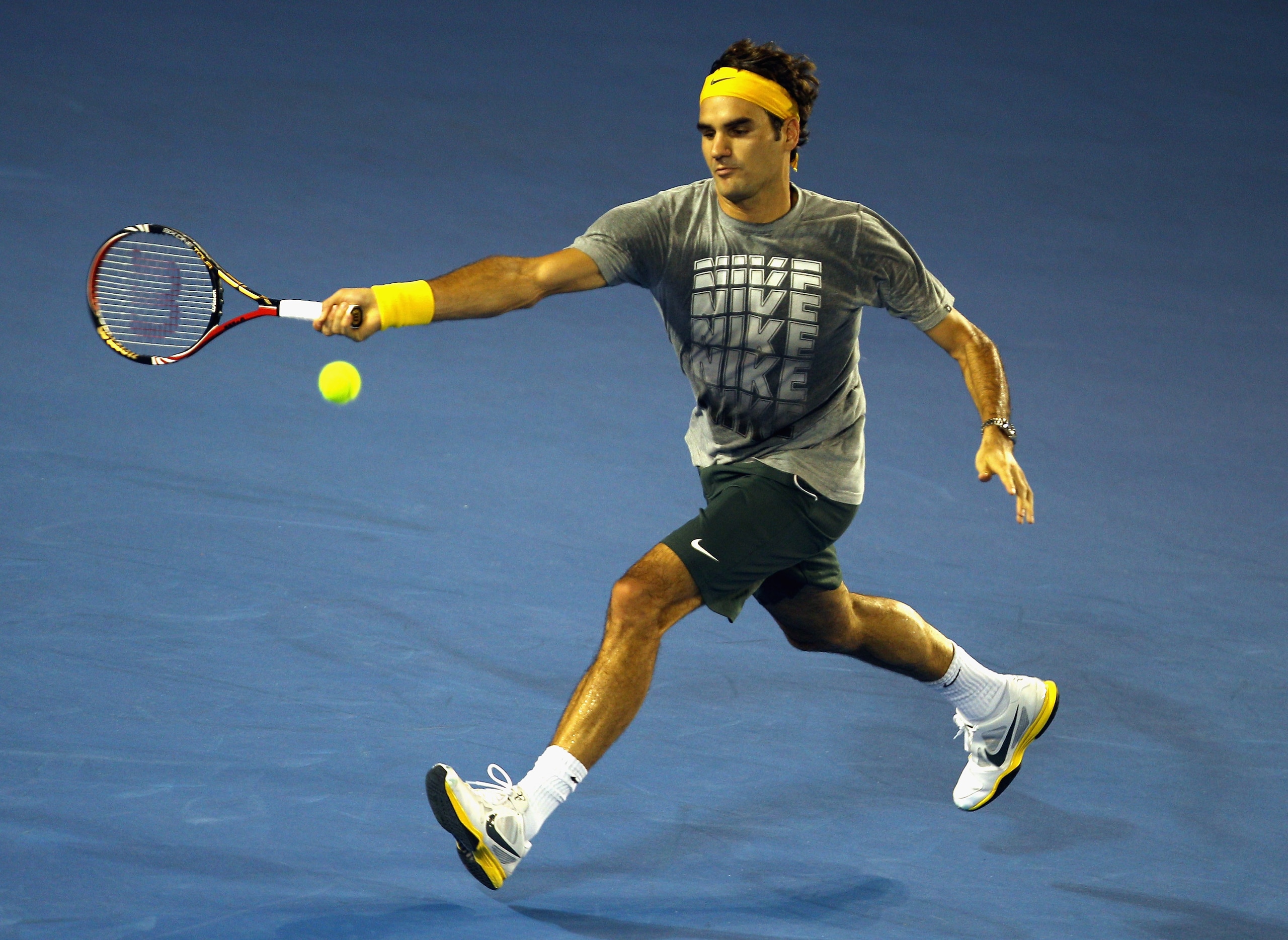 MELBOURNE, AUSTRALIA - JANUARY 13: Roger Federer of Switzerland hits a forehand during a practice session ahead of the 2011 Australian Open at Melbourne Park on January 13, 2011 in Melbourne, Australia. (Photo by Mark Dadswell/Getty Images)