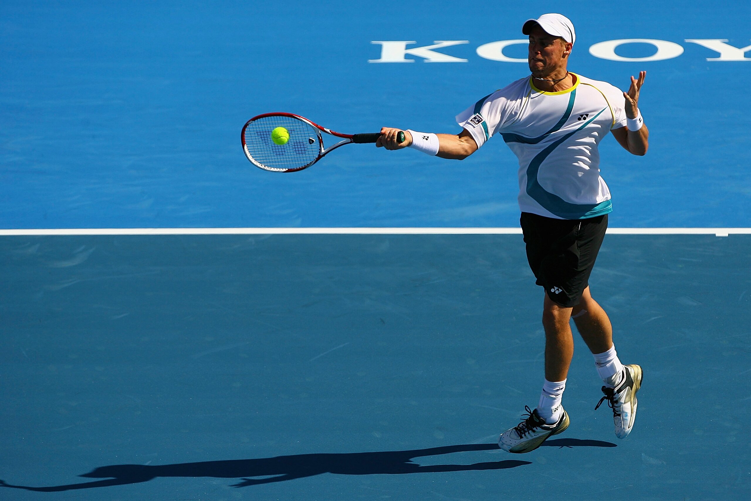 MELBOURNE, AUSTRALIA - JANUARY 14:  Lleyton Hewitt of Australia plays a forehand during his match against Nikolay Davydenko of Russia during day three of the AAMI Classic at Kooyong on January 14, 2011 in Melbourne, Australia.  (Photo by Robert Prezioso/G