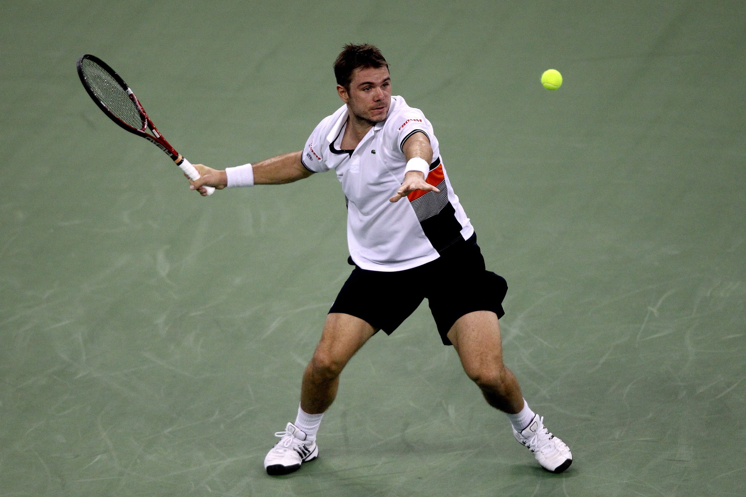 SHANGHAI, CHINA - OCTOBER 13:  Stanislas Wawrinka of Switzerland returns a shot to Rafael Nadal of Spain during day three of the 2010 Shanghai Rolex Masters at the Shanghai Qi Zhong Tennis Center on October 13, 2010 in Shanghai, China.  (Photo by Matthew