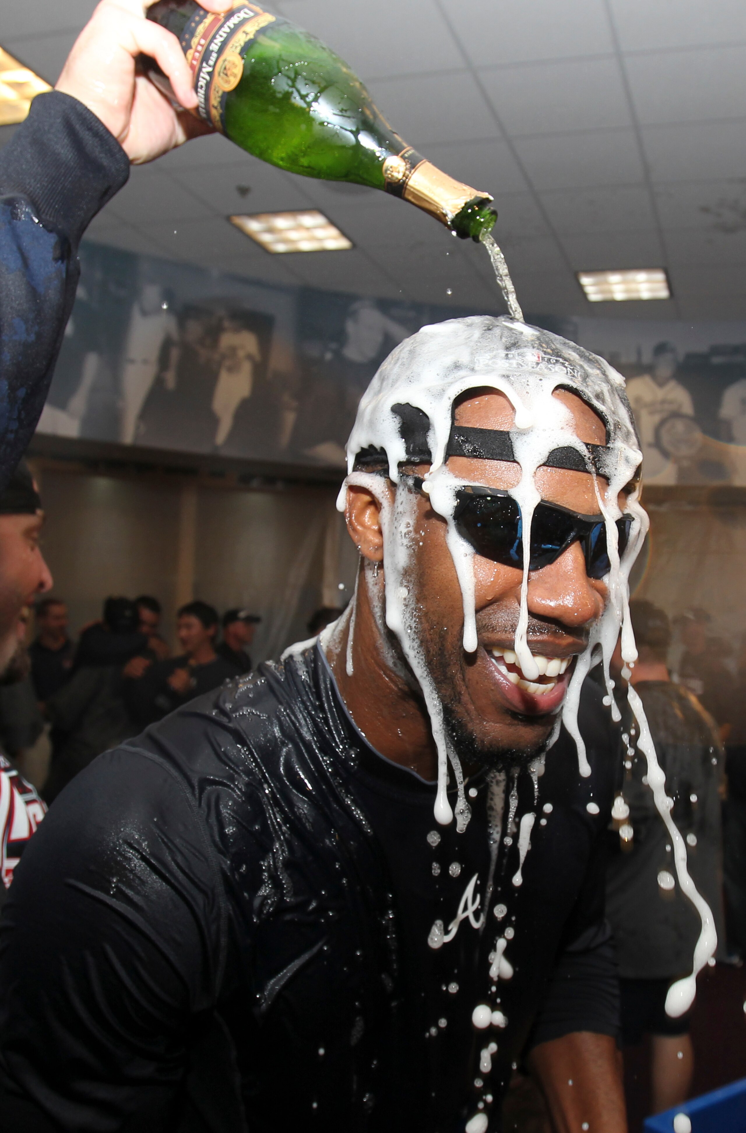 ATLANTA - OCTOBER 03:  Outfielder Jason Heyward #22 of the Atlanta Braves celebrates after the Braves clinch the National League Wildcard after the game against the Philadelphia Phillies at Turner Field on October 3, 2010 in Atlanta, Georgia.  The Braves