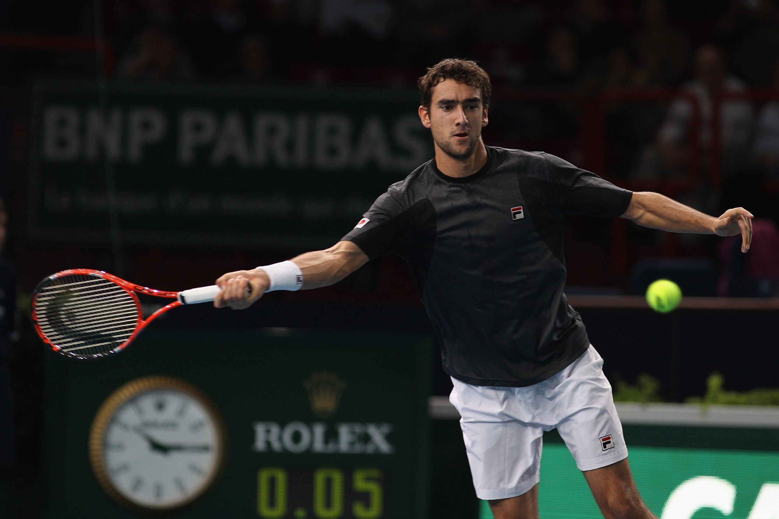 PARIS - NOVEMBER 11: Marin Cilic of Croatia in action against Andy Murray of Great Britain  during Day Five of the ATP Masters Series Paris at the Palais Omnisports on November 11, 2010 in Paris, France.  (Photo by Michael Steele/Getty Images)