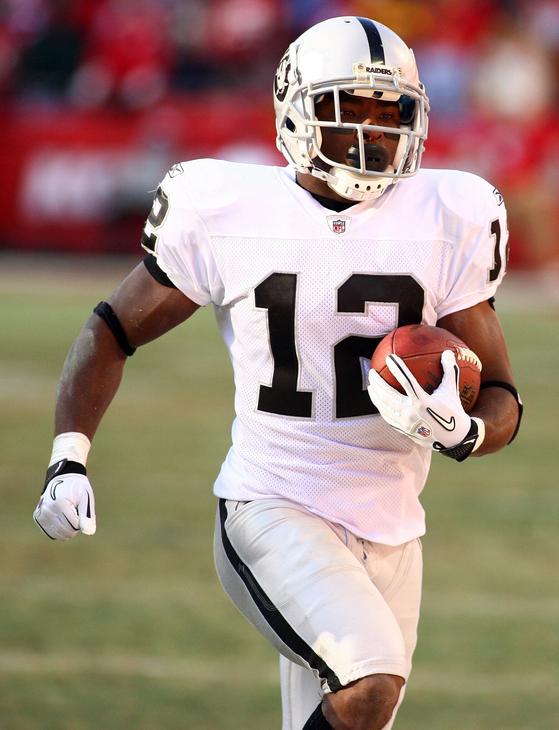 KANSAS CITY, MO - JANUARY 02:  Wide receiver Jacoby Ford #12 of the Oakland Raiders runs down field in a game against the Kansas City Chiefs at Arrowhead Stadium on January 2, 2011 in Kansas City, Missouri.  (Photo by Tim Umphrey/Getty Images)