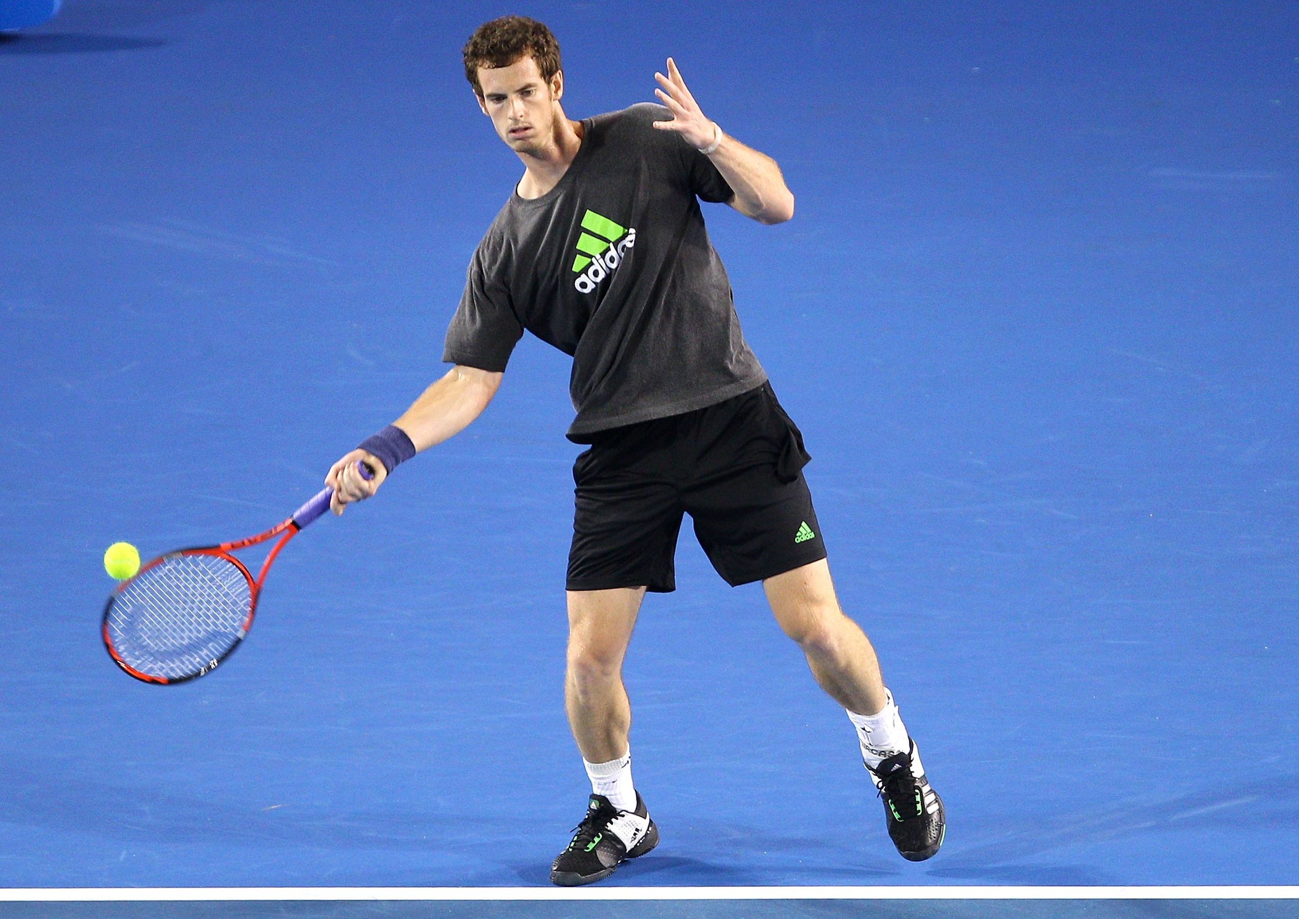 MELBOURNE, AUSTRALIA - JANUARY 14: Andy Murray of Great Britain hits a forehand during a practice session ahead of the 2011 Australian Open at Melbourne Park on January 14, 2011 in Melbourne, Australia. (Photo by Lucas Dawson/Getty Images)