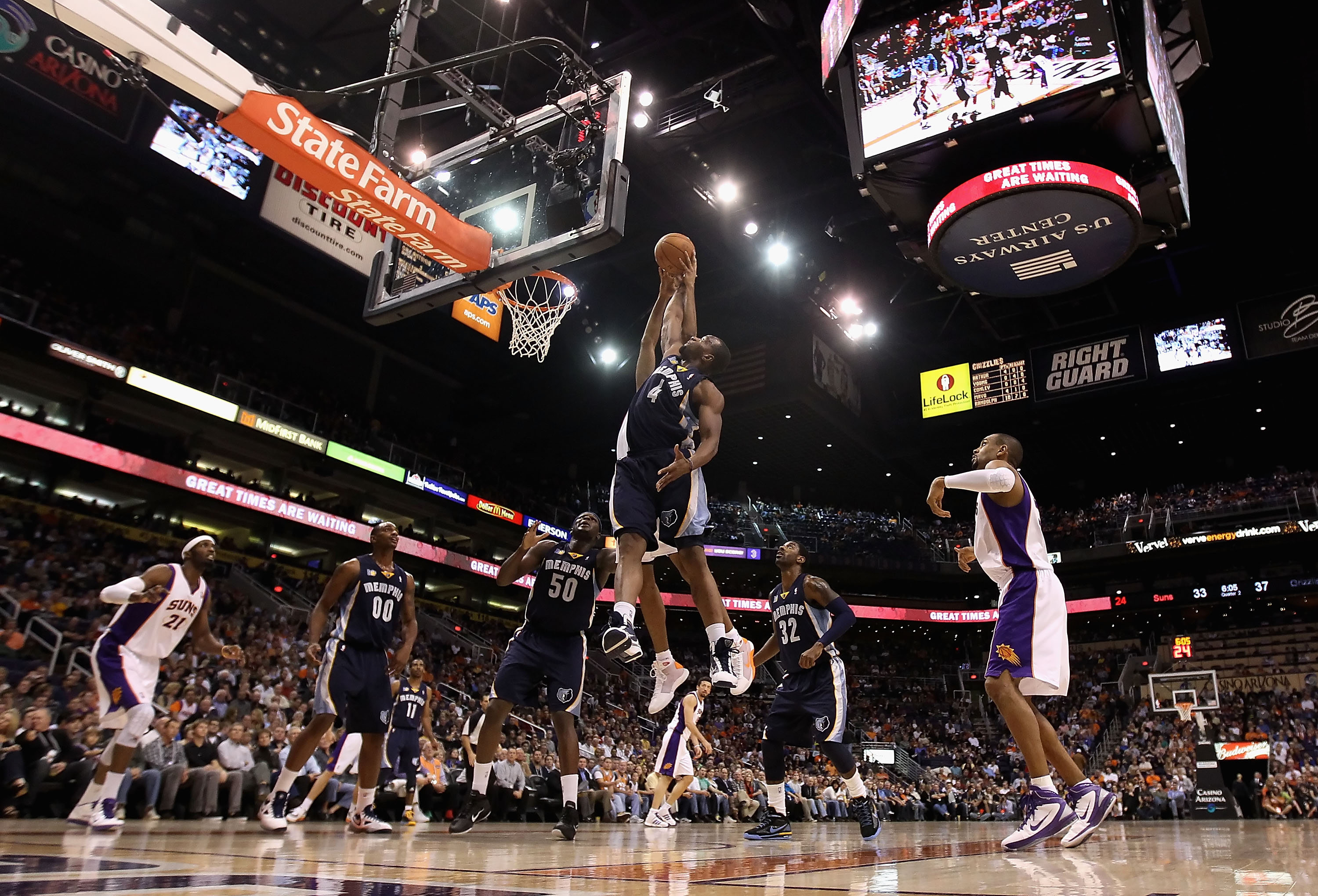 PHOENIX - DECEMBER 08:  Sam Young #4 of the Memphis Grizzlies jumps for a rebound against the Phoenix Suns during the NBA game at US Airways Center on December 8, 2010 in Phoenix, Arizona. NOTE TO USER: User expressly acknowledges and agrees that, by down