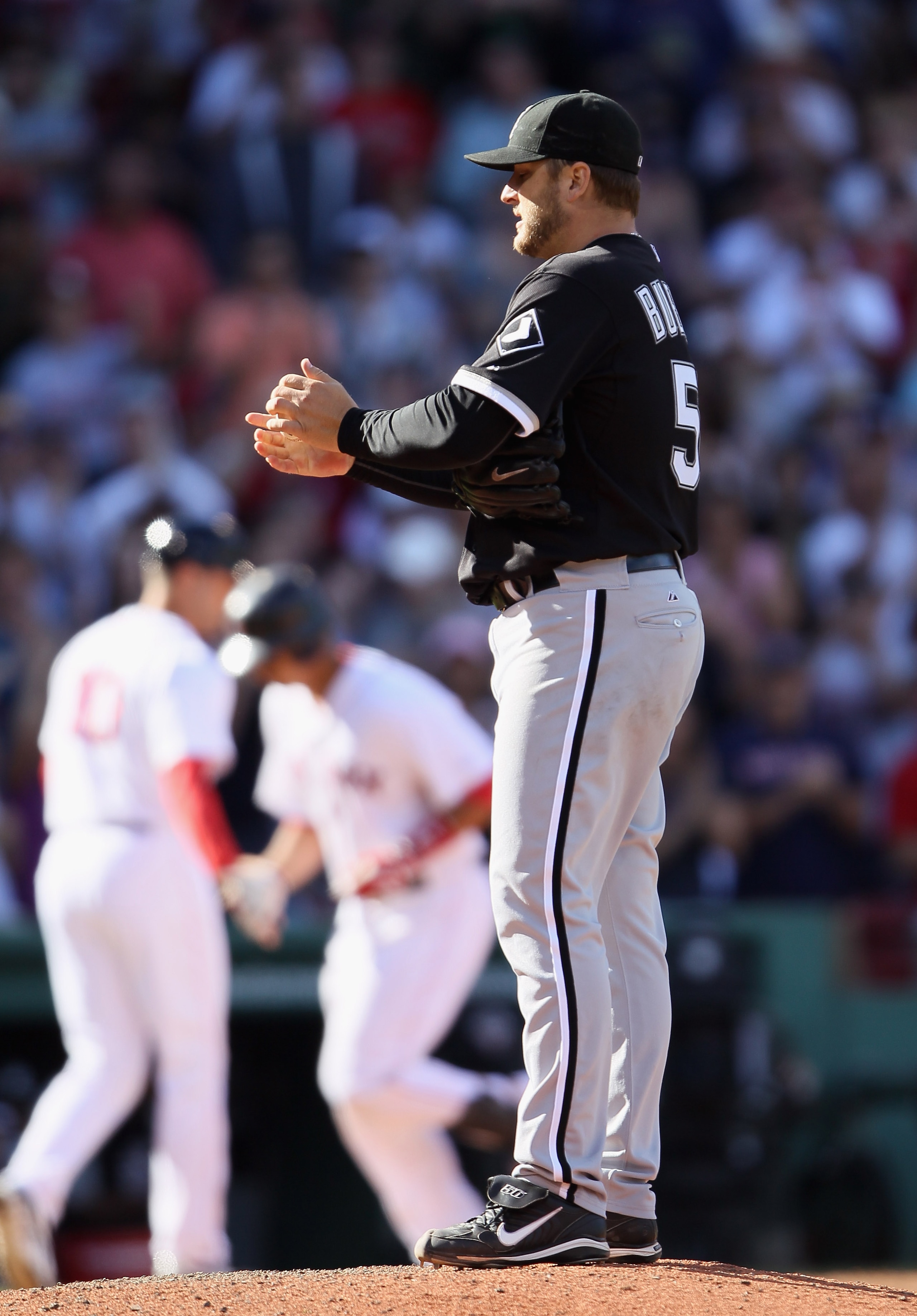BOSTON - SEPTEMBER 05:  Mark Buehrle #56 of the Chicago White Sox reacts after giving up a two run homer to Victor Martinez of the Boston Red Sox in the seventh inning on September 5, 2010 at Fenway Park in Boston, Massachusetts.  (Photo by Elsa/Getty Ima
