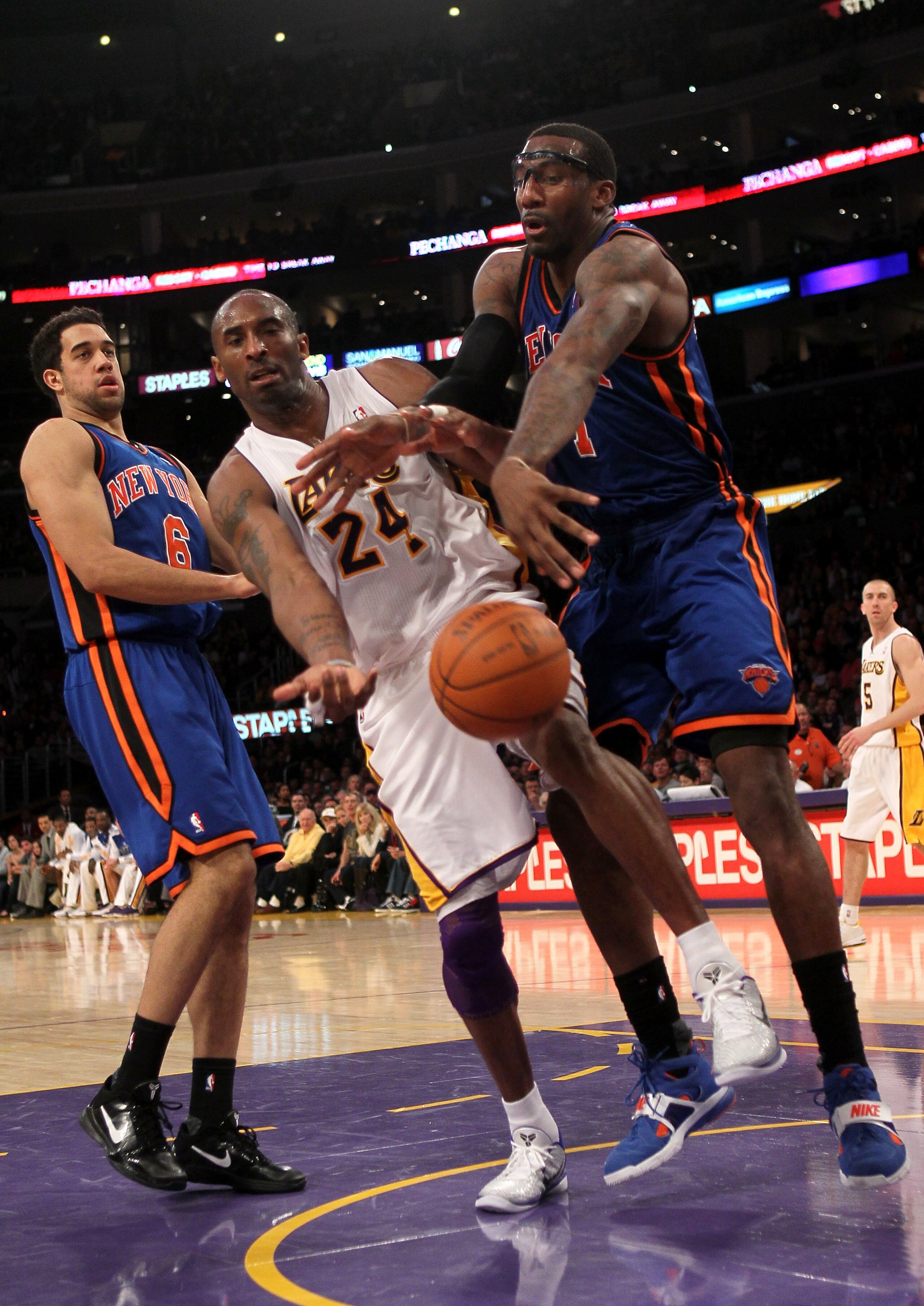 LOS ANGELES, CA - JANUARY 09:  Amar'e Stoudemire #1 of the New York Knicks knocks the ball away from Kobe Bryant #24 of the Los Angeles Lakers at Staples Center on January 9, 2011 in Los Angeles, California.  The Lakers won 109-87.   NOTE TO USER: User ex