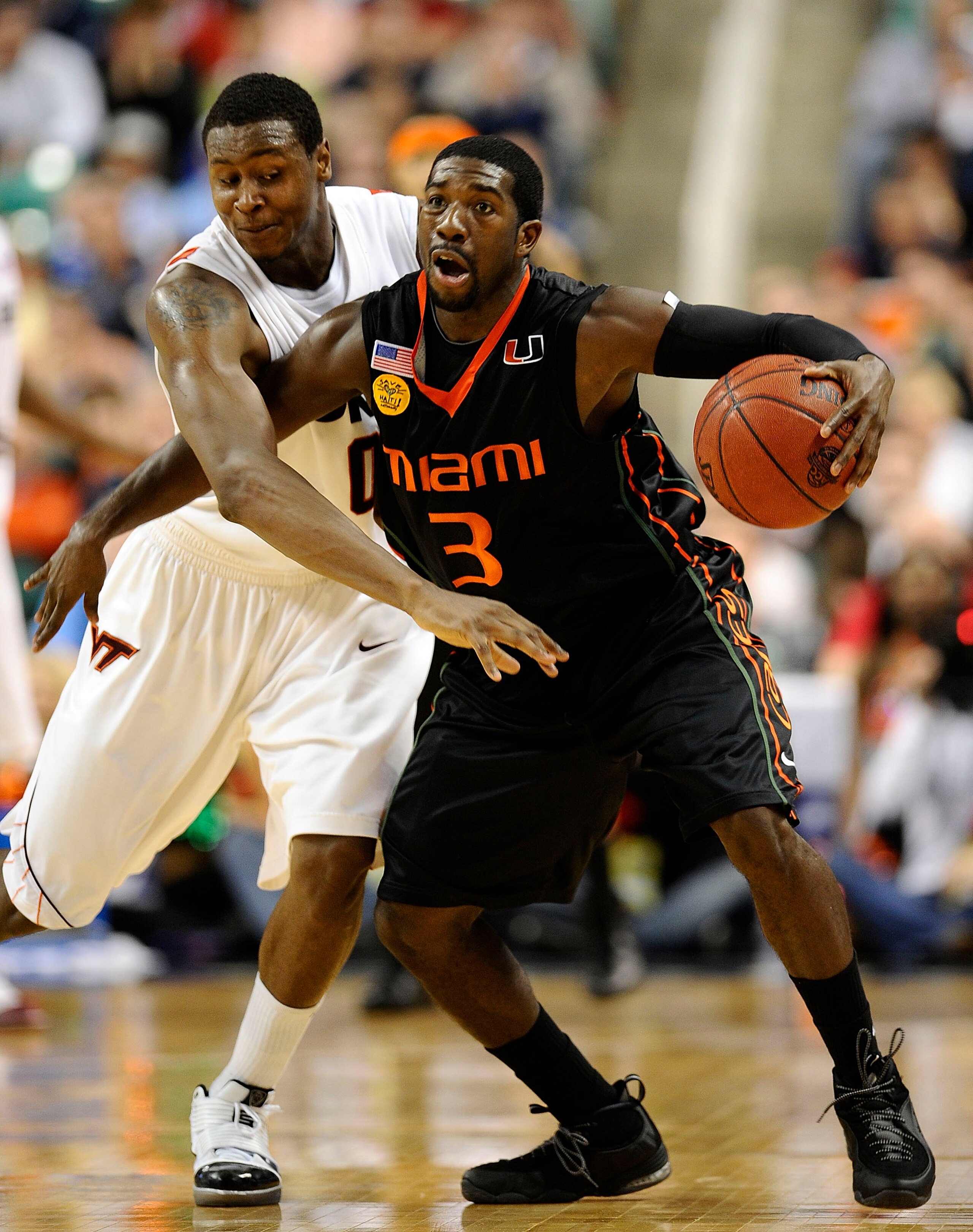 GREENSBORO, NC - MARCH 12:  Jeff Allen #00 of the Virginia Tech Hokies guards Malcolm Grant #3 of the University of Miami Hurricanes in their quarterfinal game in the 2010 ACC Men's Basketball Tournament at the Greensboro Coliseum on March 12, 2010 in Gre