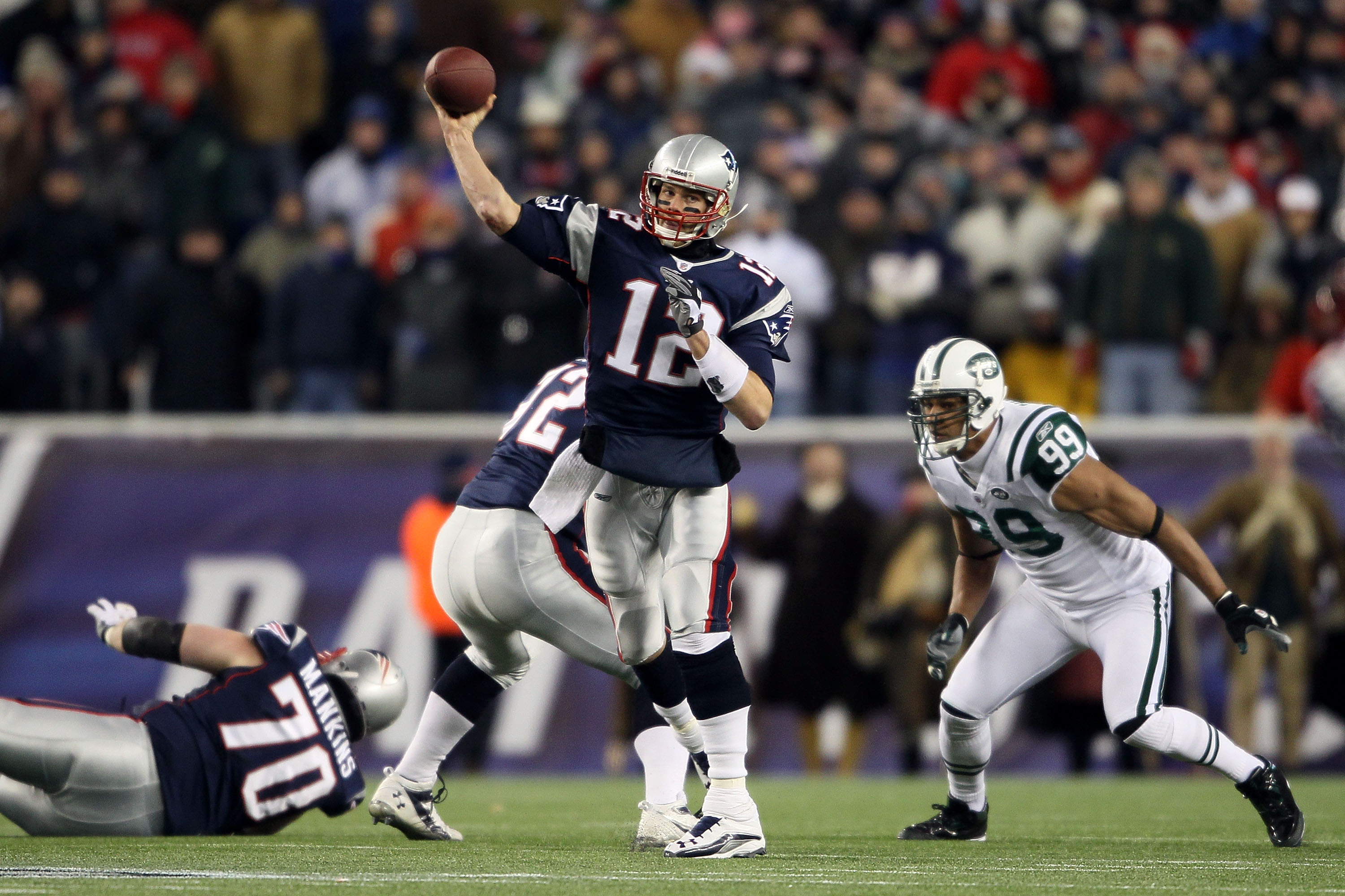 New England Patriots quarterback Tom Brady (12) calls a play in the huddle  in the first quarter against the New York Jets at Gillette Stadium in  Foxboro, Massachusetts on December 6, 2010.