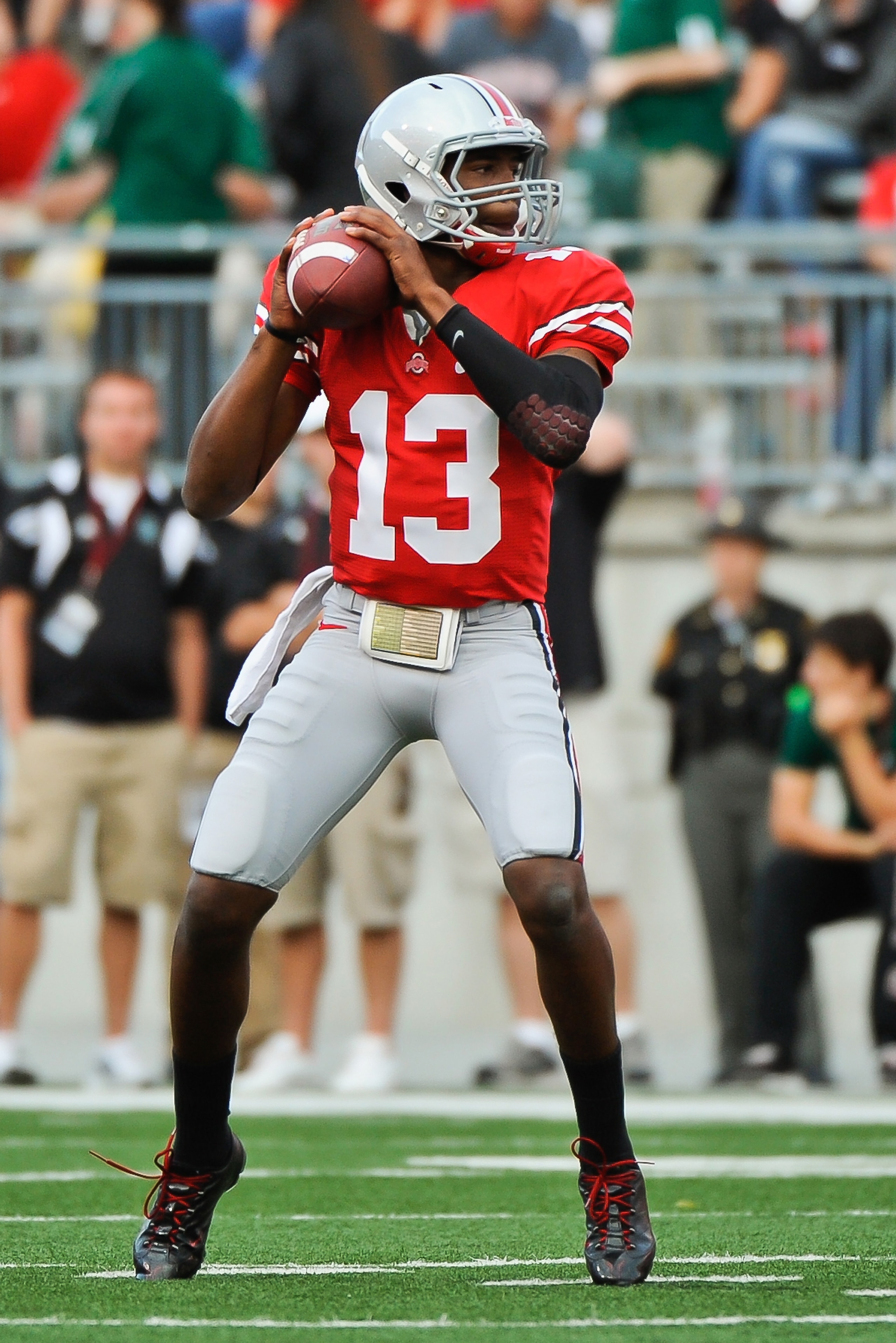 COLUMBUS, OH - SEPTEMBER 25:  Ken Guiton #13 of the Ohio State Buckeyes passes against the Eastern Michigan Eagles at Ohio Stadium on September 25, 2010 in Columbus, Ohio.  Ohio State won 73-20. (Photo by Jamie Sabau/Getty Images)