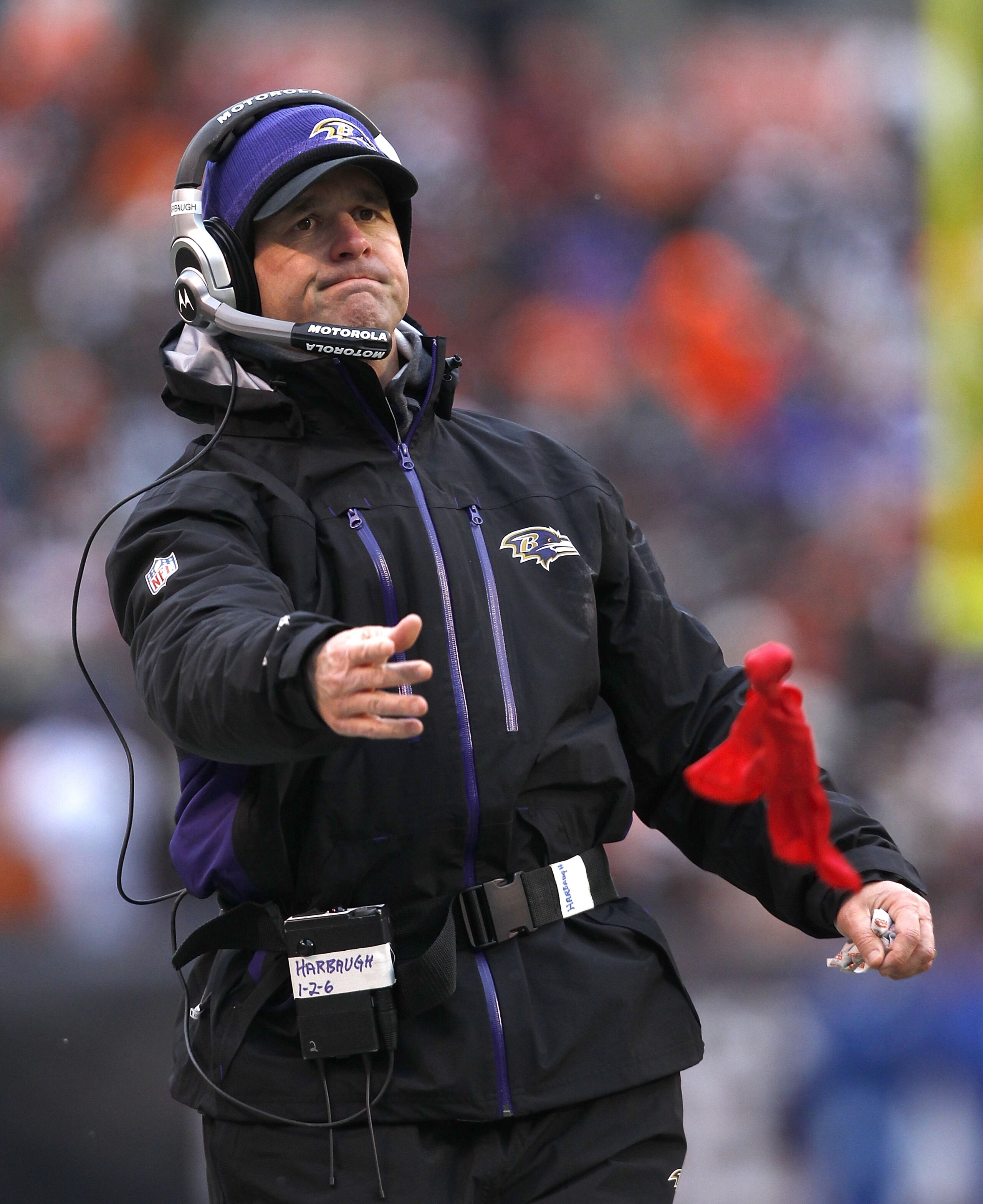 CLEVELAND - DECEMBER 26:  Head Coach John Harbaugh of the Baltimore Ravens throws a challenge flag during their game against the Cleveland Browns at Cleveland Browns Stadium on December 26, 2010 in Cleveland, Ohio.  (Photo by Matt Sullivan/Getty Images)