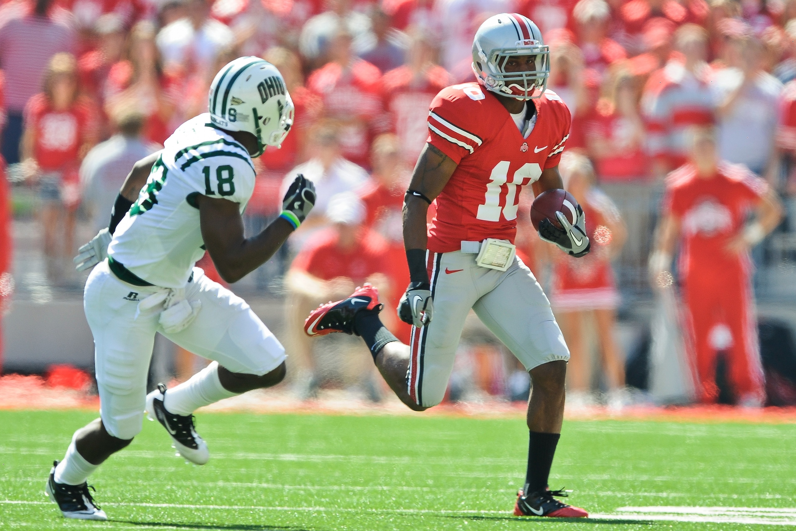 COLUMBUS, OH - SEPTEMBER 18:  Corey Brown #10 of the Ohio State Buckeyes runs with the ball as Travis Carrie #18 of the Ohio Bobcats defends at Ohio Stadium on September 18, 2010 in Columbus, Ohio.  (Photo by Jamie Sabau/Getty Images)