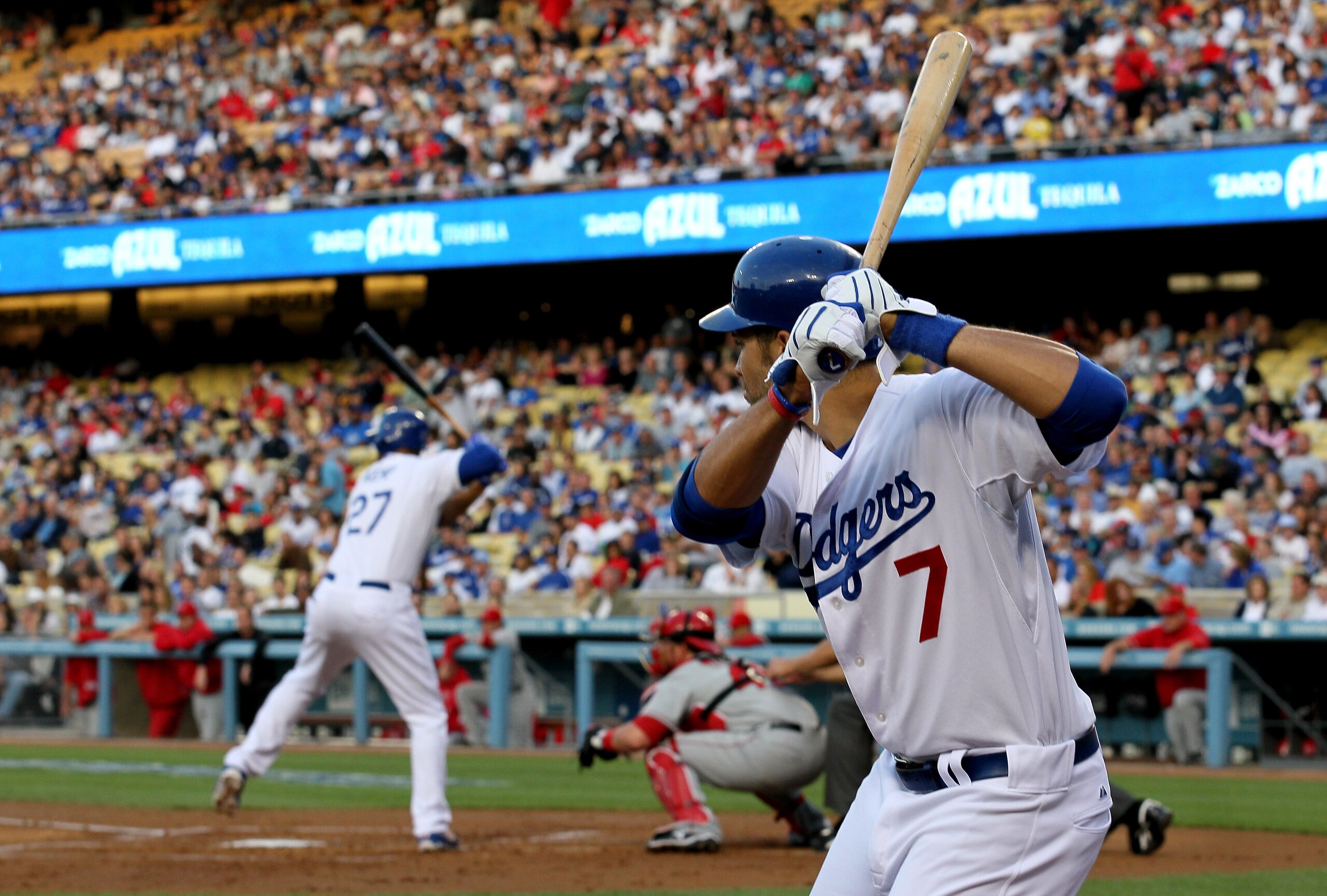 LOS ANGELES - JUNE 12: James Loney #7 of the Los Angeles Dodgers gets ready in the on deck circle as Matt Kemp #27 bats against the Los Angeles Angels of Anaheim on June 12, 2010 at Dodger Stadium in Los Angeles, California.   (Photo by Stephen Dunn/Getty