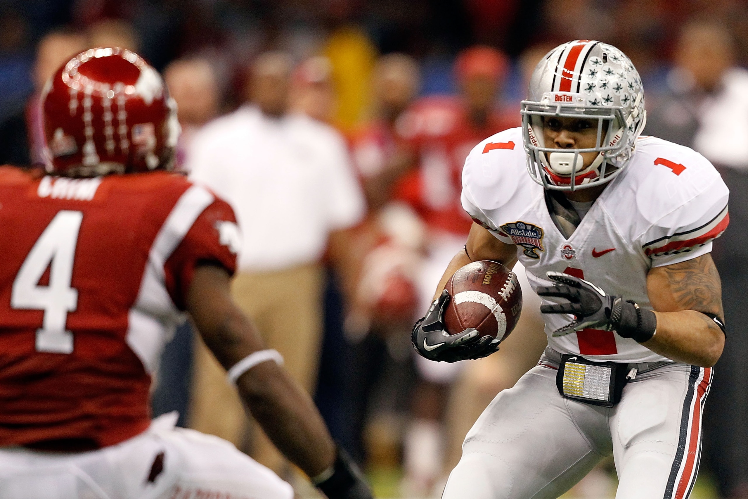 NEW ORLEANS, LA - JANUARY 04: Dan Herron #1 of the Ohio State Buckeyes runs the ball against the Arkansas Razorbacks during the Allstate Sugar Bowl at the Louisiana Superdome on January 4, 2011 in New Orleans, Louisiana. (Photo by Matthew Stockman/Getty NEW ORLEANS, LA - JANUARY 04: Dan Herron #1 of the Ohio State Buckeyes runs the ball against the Arkansas Razorbacks during the Allstate Sugar Bowl at the Louisiana Superdome on January 4, 2011 in New Orleans, Louisiana. (Photo by Matthew Stockman/Getty