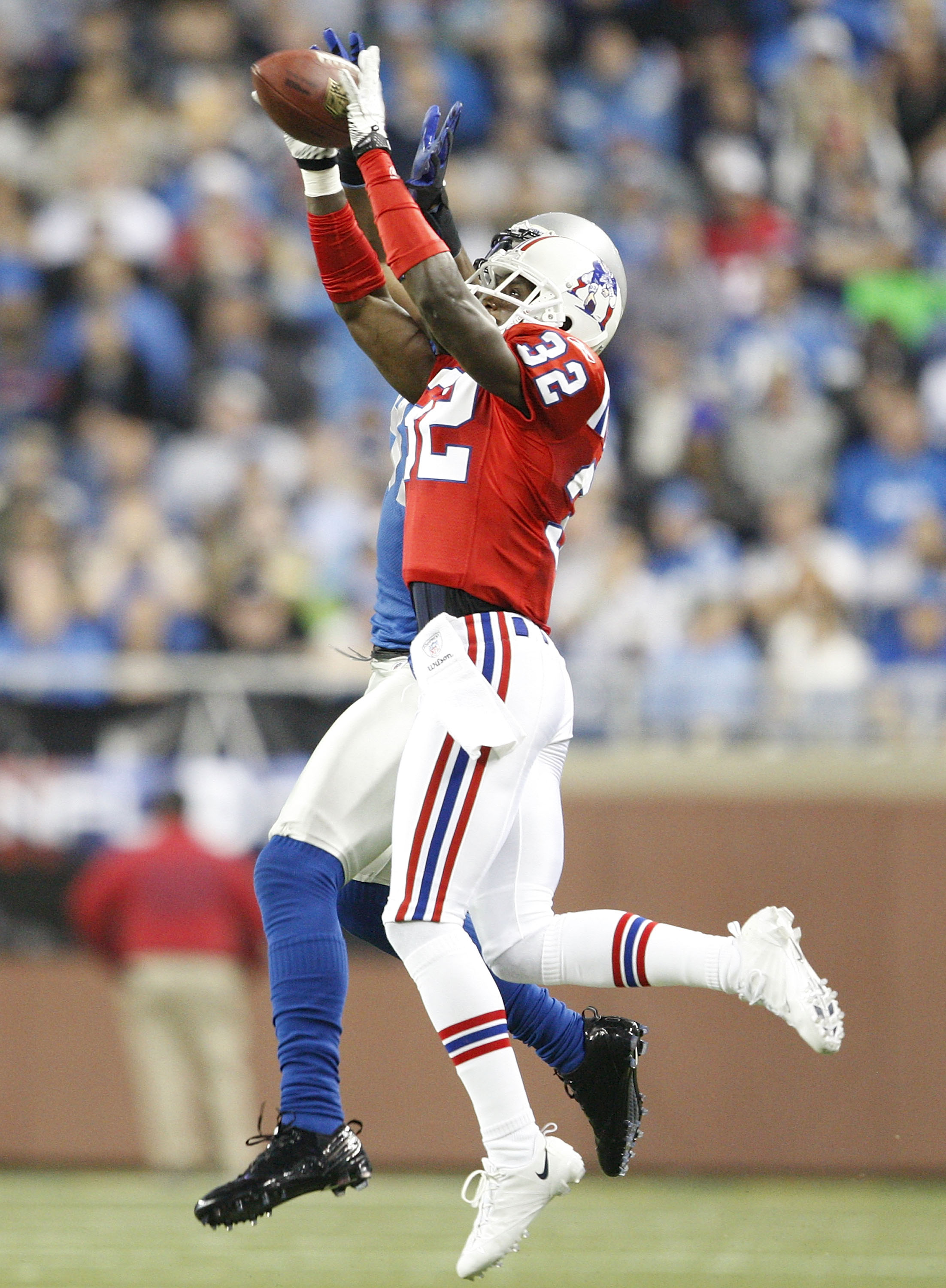 DETROIT - NOVEMBER 25:  Devin McCourty #32 of the New England Patriots intercepts the ball during the fourth quarter of the game against the Detroit Lions at Ford Field on November 25, 2010 in Detroit, Michigan. New England defeated Detroit 45-24.  (Photo