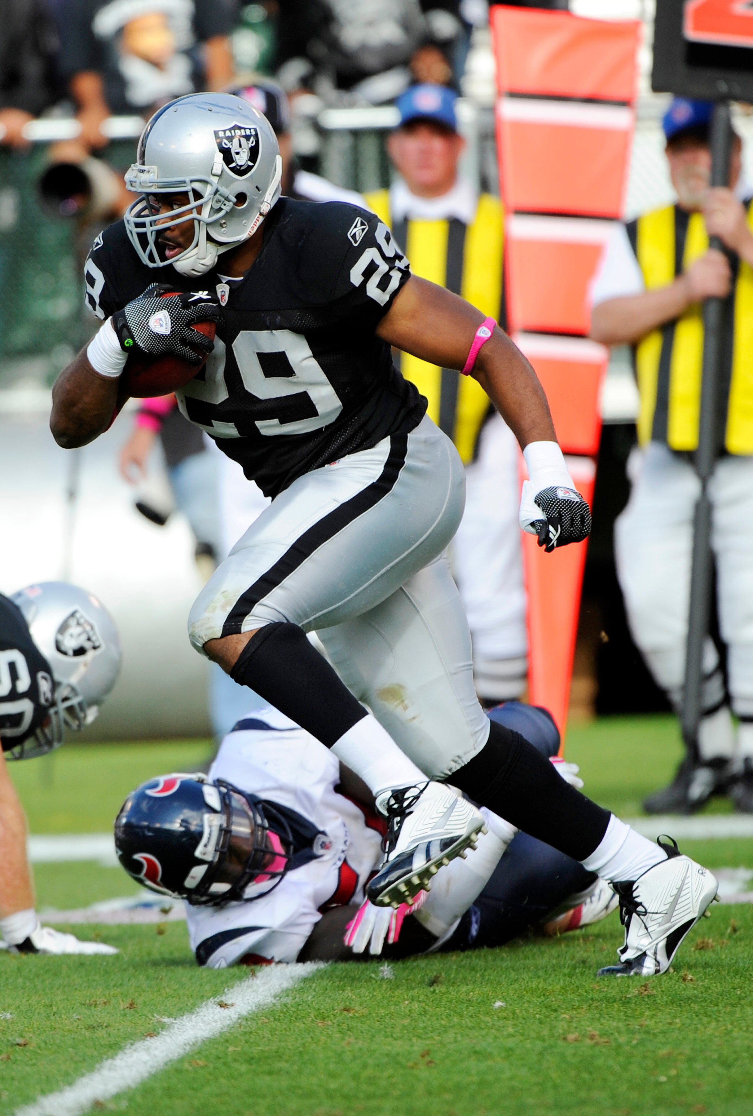 OAKLAND, CA - OCTOBER 3:  Running back Michael Bush #29 of the Oakland Raiders carries the ball against the Houston Texans  during an NFL football game October 3, 2010 at The Oakland-Alameda County Coliseum in Oakland, California. The Texans won the game